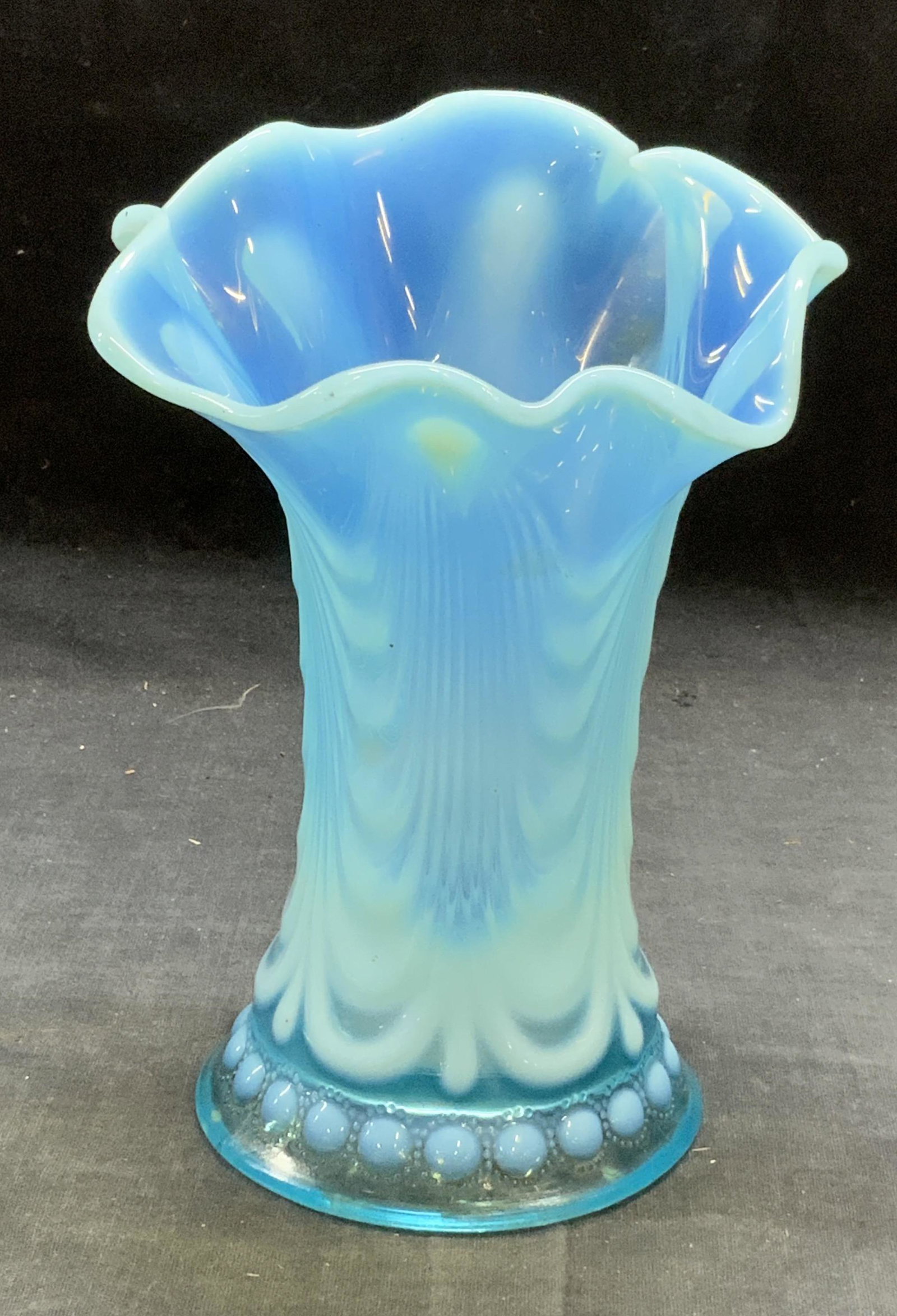 Jewels & Drapery Handkerchief Art Glass Vase: Vintage, possibly antique, opalescent art glass vase with pulled design and handkerchief rim. Jewels and drapery pattern. Fluoresces under blacklight. Measure approx. 5 inches wide and 7 inches tall. 