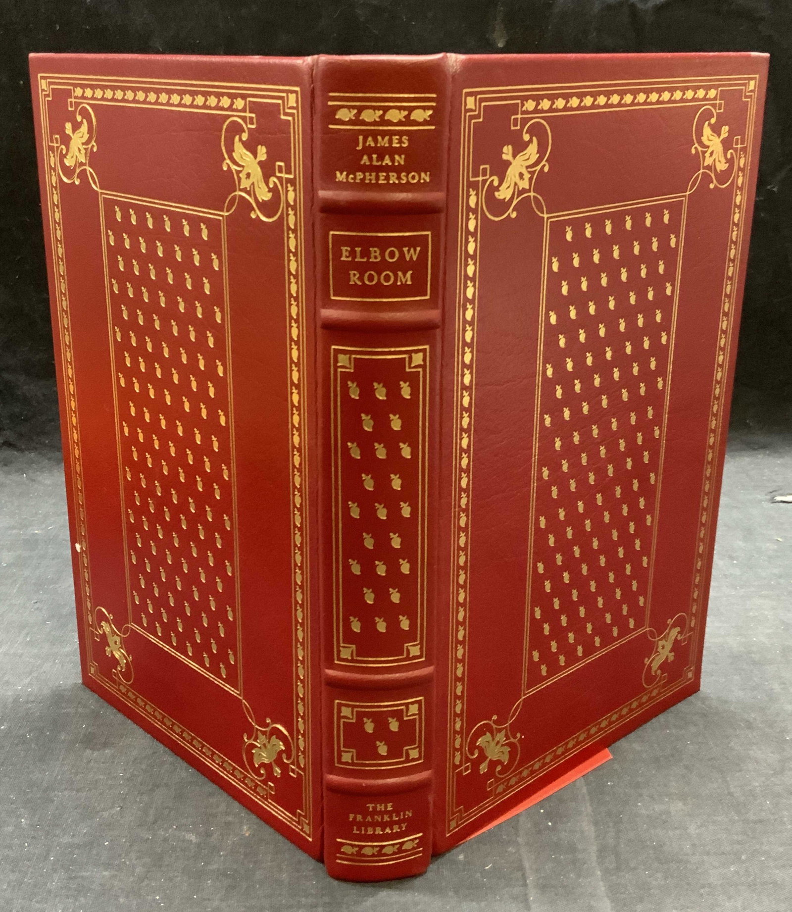 Franklin Edt Elbow Room McPherson, Illustrated: Franklin Edition hardbound copy of Elbow Room by James Alan McPherson. Published by The Franklin Library, 1980. Illustrated by Ben Wohlberg. Leather bound with gilt decoration. Minimal shelf wear cons