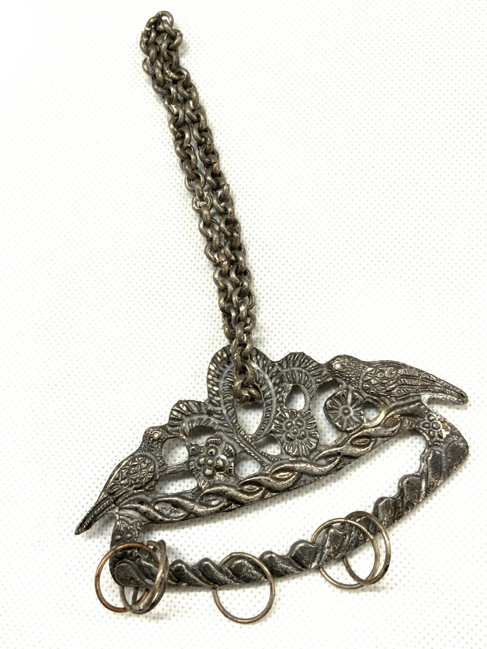 Vintage Pewter Chatelaine: Vintage Pewter made accessory, possibly a Chatelaine with top hanging chain and various jump rings. Chatelaine has cut outs with images of birds. Approximately 6.5 inches long and 4 inches wide. Evide