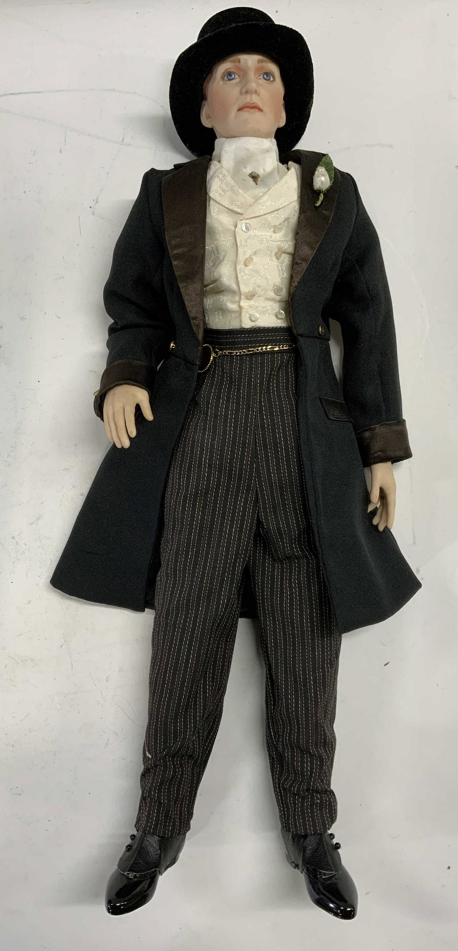 Vintage Male Porcelain Doll with Suit & Top Hat: Vintage male porcelain doll with suit and top hat. Some surface wear consistent with exposure. Measures approx. 23 inches long. Vintage doll, male doll, porcelain doll, doll suit, collectible doll, di