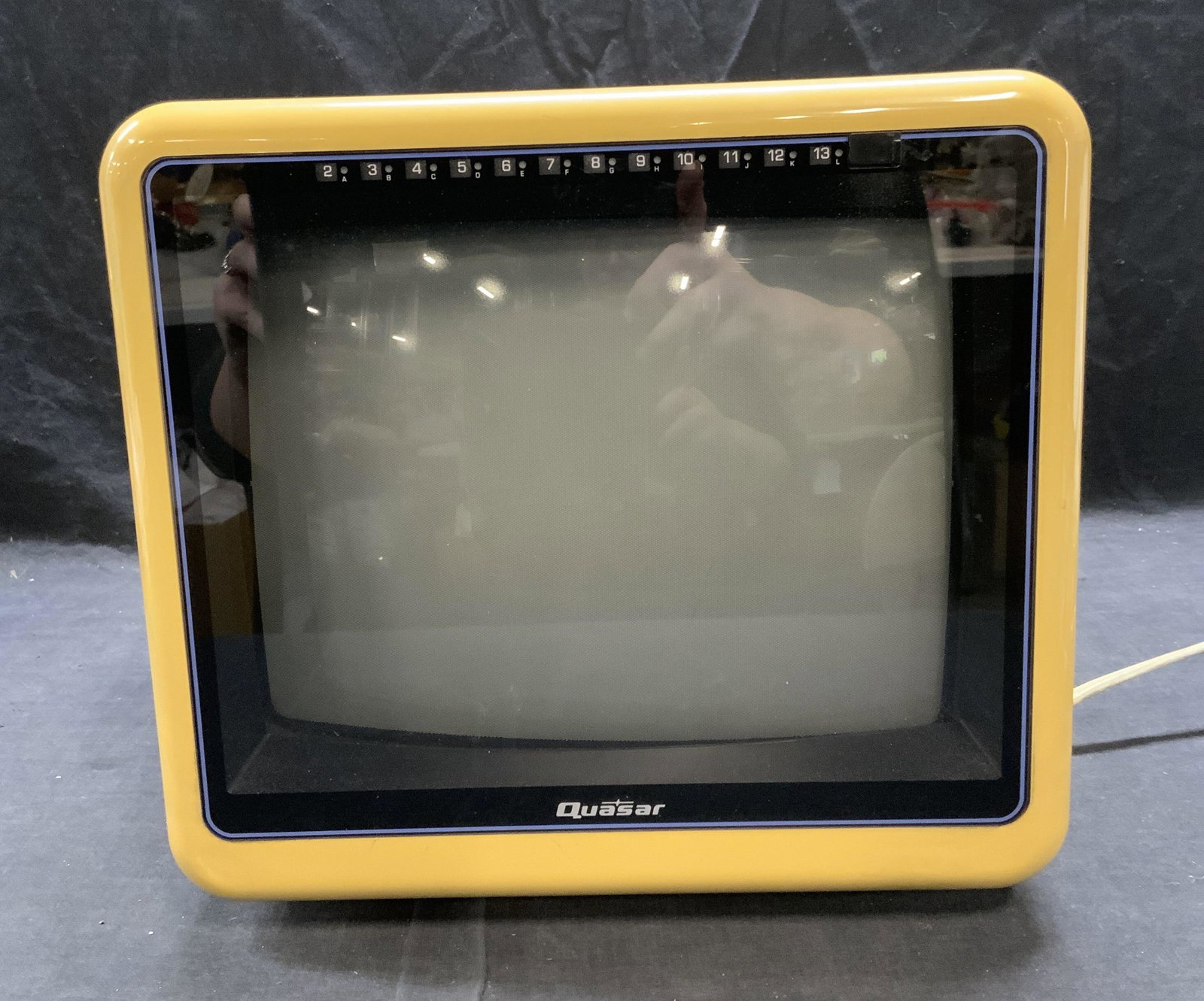 Vintage QUASAR Yellow Portable Television: Vintage Quasar yellow portable television. Plastic and metal. Not tested for function. Surface wear consistent with exposure. Measures approx. 11 x 10.5 x 10.25 inches. Quasar, quasar television, yell