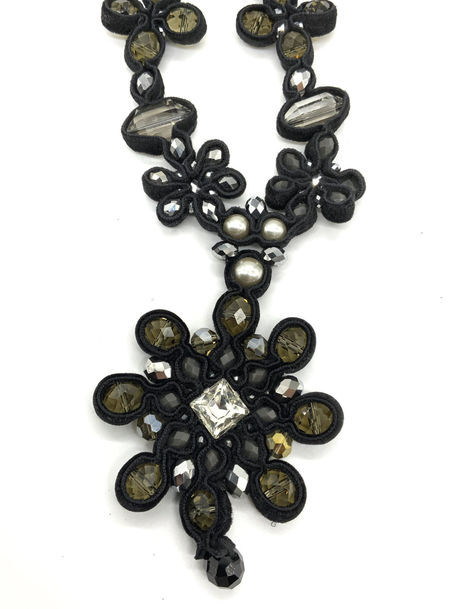 Rush Dennis & Charles Crystal Pendant Necklace: Rush by Dennis and Charles black crystal pendant necklace with fabric detail. Designer label on jewelry charm. Toggle clasp. Measures approx. 20 inches long. Some surface wear consistent with exposure