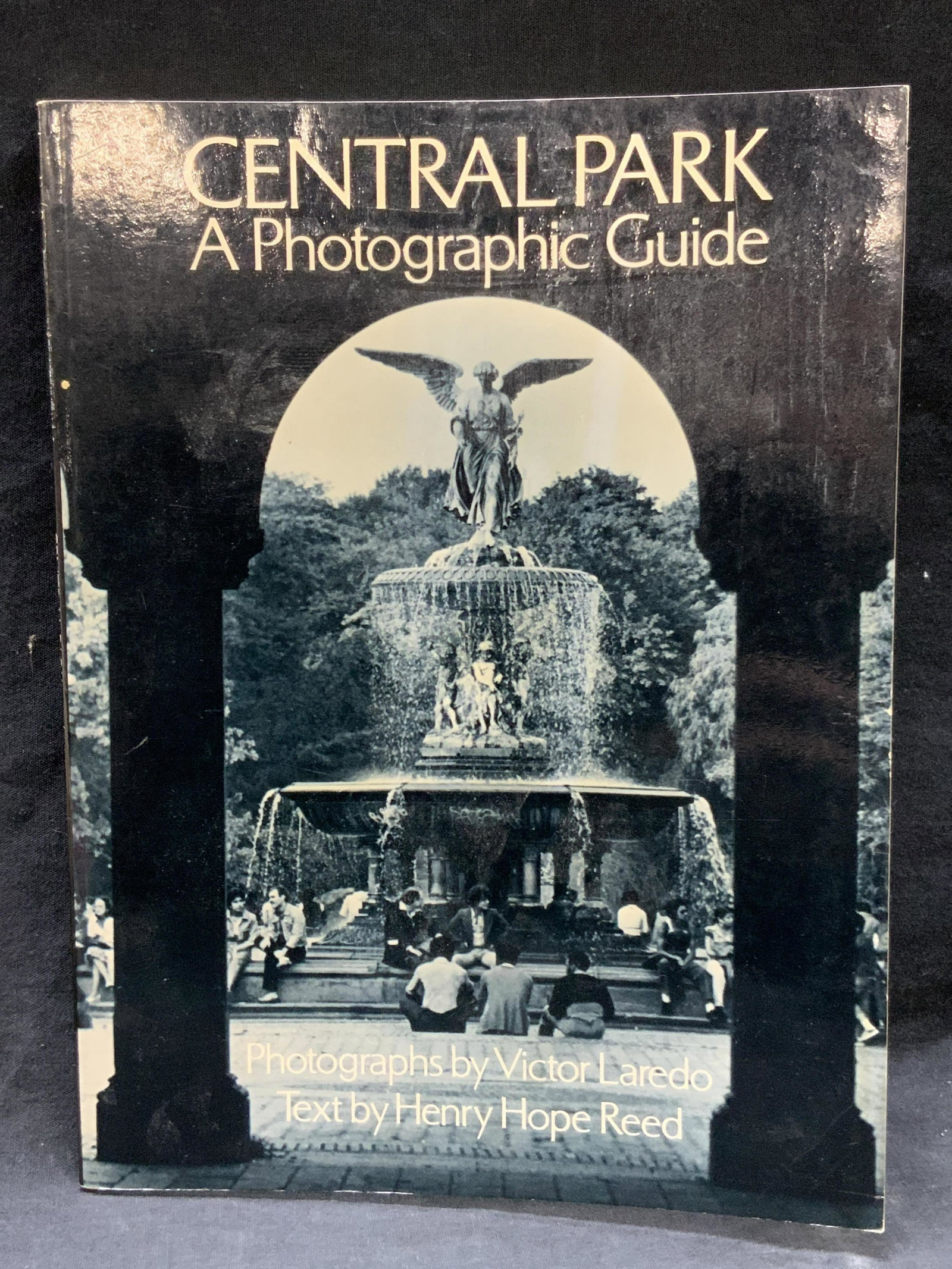 Central Park A Photographic Guide: Paper bag book. Titled Central Park A Photographic Guide, Photographs by Victor Laredo text by Henry Hope Reed. Published by Dover Publications Inc, NY. Copyright 1979. Complete with black and white p
