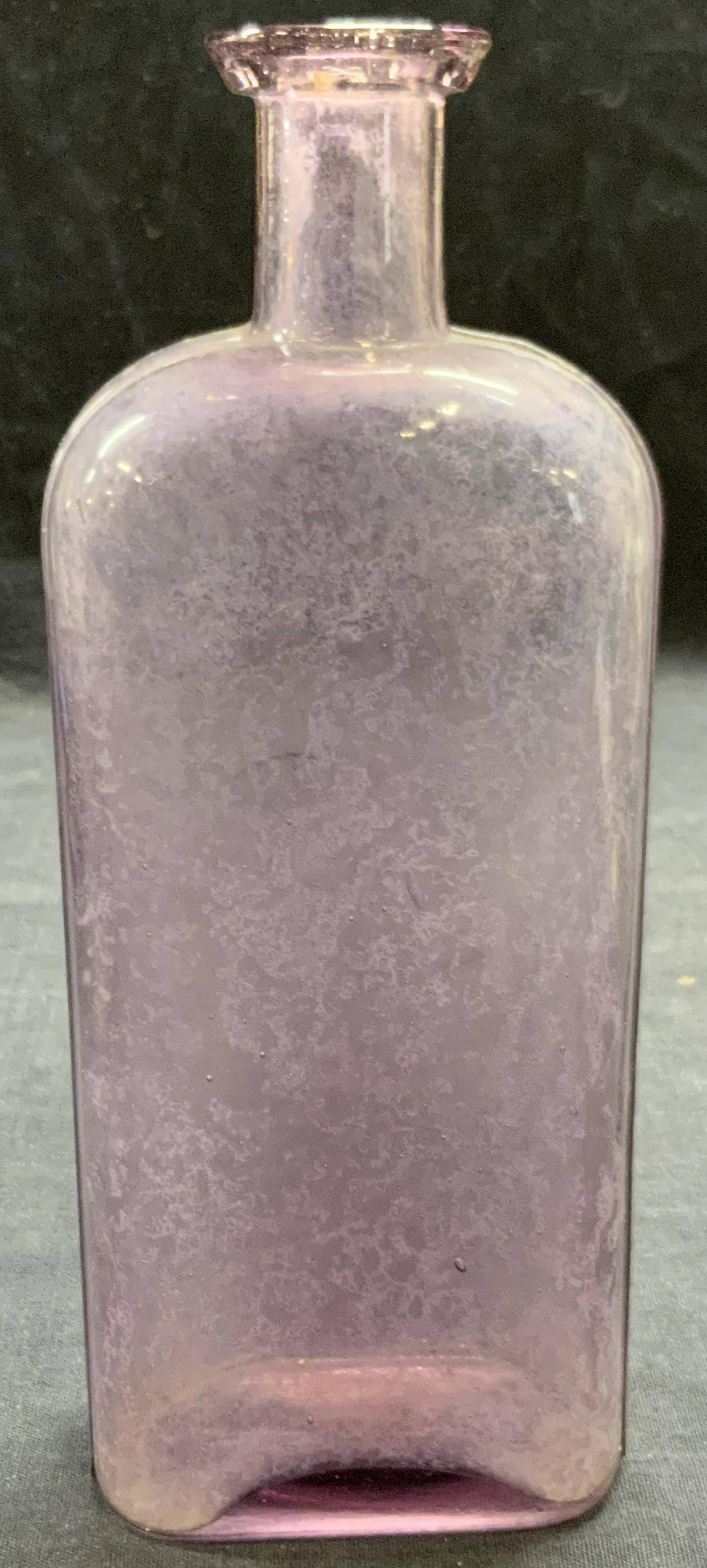 Vintage Purple Toned Glass Bottle Auction