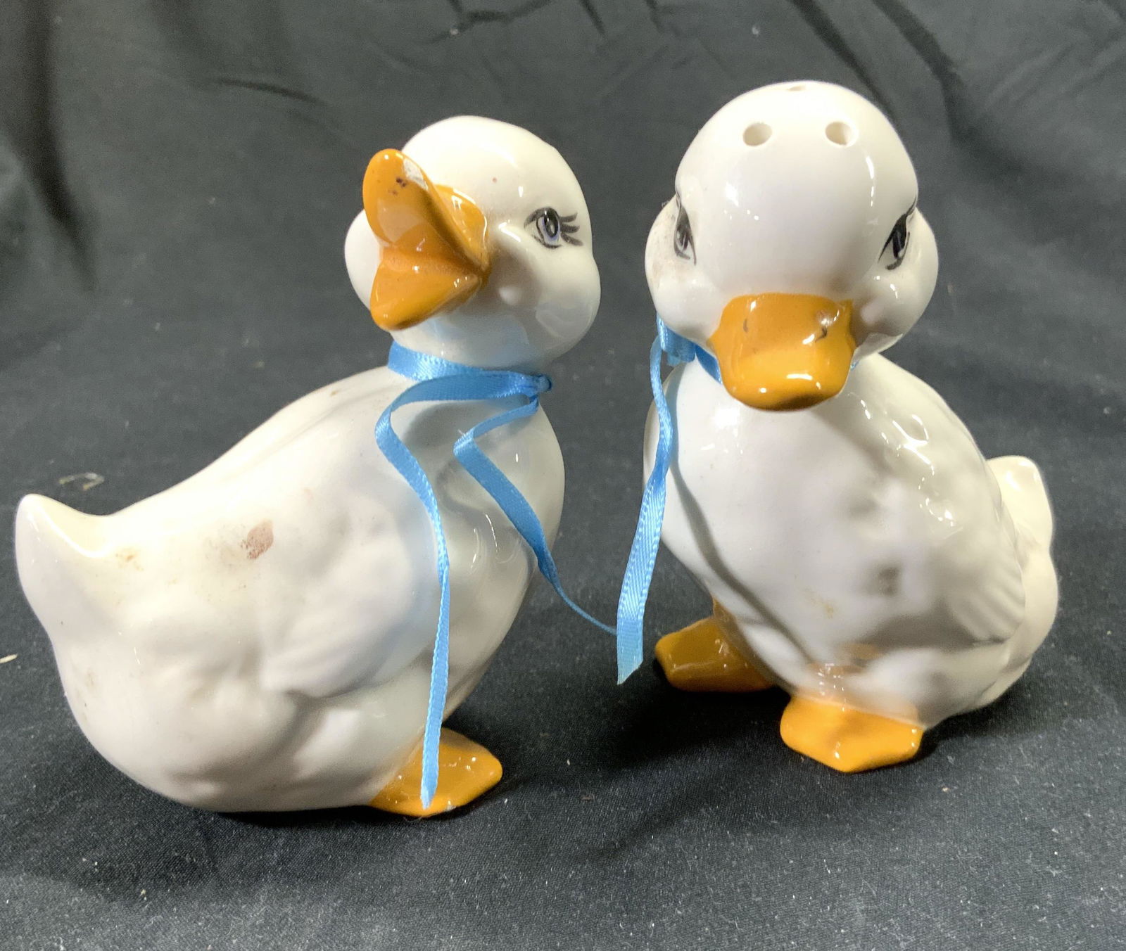 Lot 2 Vntg Porc Duck Salt & Pepper Shakers: Lot includes 1 salt and 1 pepper shaker. Each shaker is duck shaped. One with beak open one with beak closed. Each measures approx 3.5 inches tall 3 inches deep 2 inches wide. Salt and pepper shakers,
