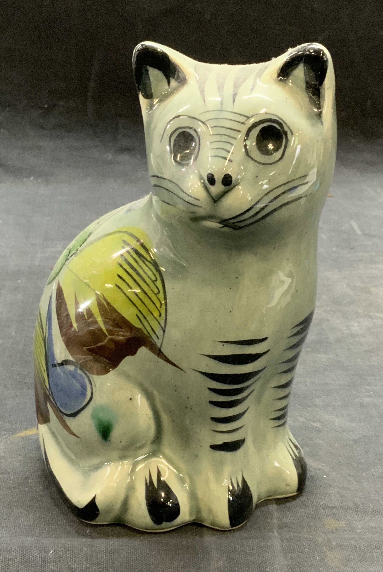 Hand Painted Pottery Cat Figural, Mexico: Hand painted pottery cat figural. Marked Mexico to underside. Some surface wear consistent with exposure. Measures approx. 3.75 x 3 x 6 inches. Cat, cat figural, ceramic cat, art pottery, decorative a