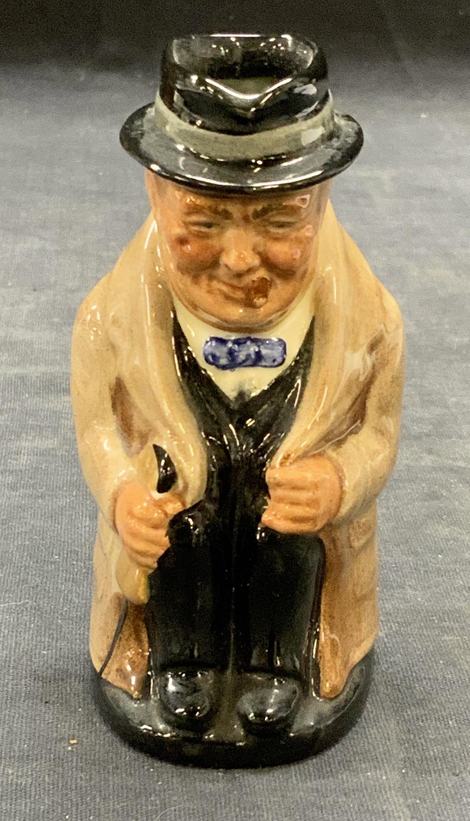 Royal DOULTON Ceramic Winston Churchill Toby Jug: Royal DOULTON ceramic Winston Churchill Toby jug. Trademarked to underside. Made in England, some surface wear consistent with exposure. Measures approx. 2 x 2.25 x 3.75 inches. Royal DOULTON, royal D