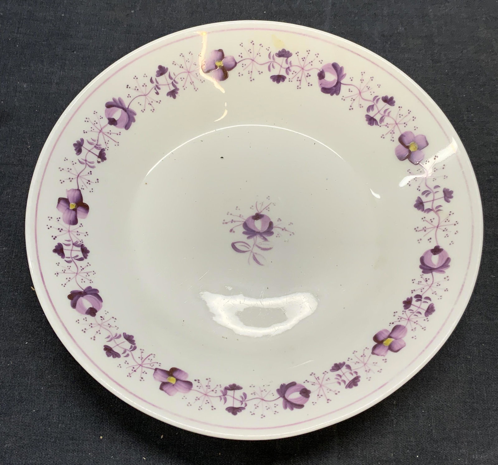 Antique Hand Painted Porcelain Floral Bowl: Antique porcelain bowl with floral violet motif. Hand painted. Some surface wear consistent with exposure. Measures approx. 7.5 x 1.25 inches. Antiques, antique bowl, antique tableware, collectibles, 
