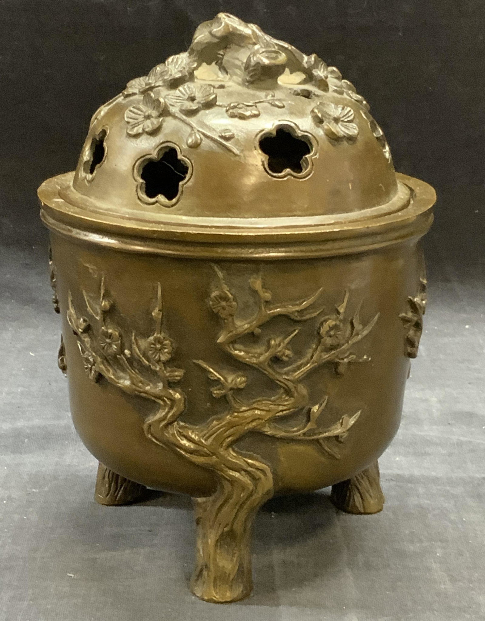 Stamped Chinese Bronze Botanical Incense Burner: Stamped Chinese bronze incense burner with botanical tree motif. Signature stamp to underside. Some surface wear consistent with exposure. Measures approx. 4.75 inches diameter and 6.25 inches tall. P