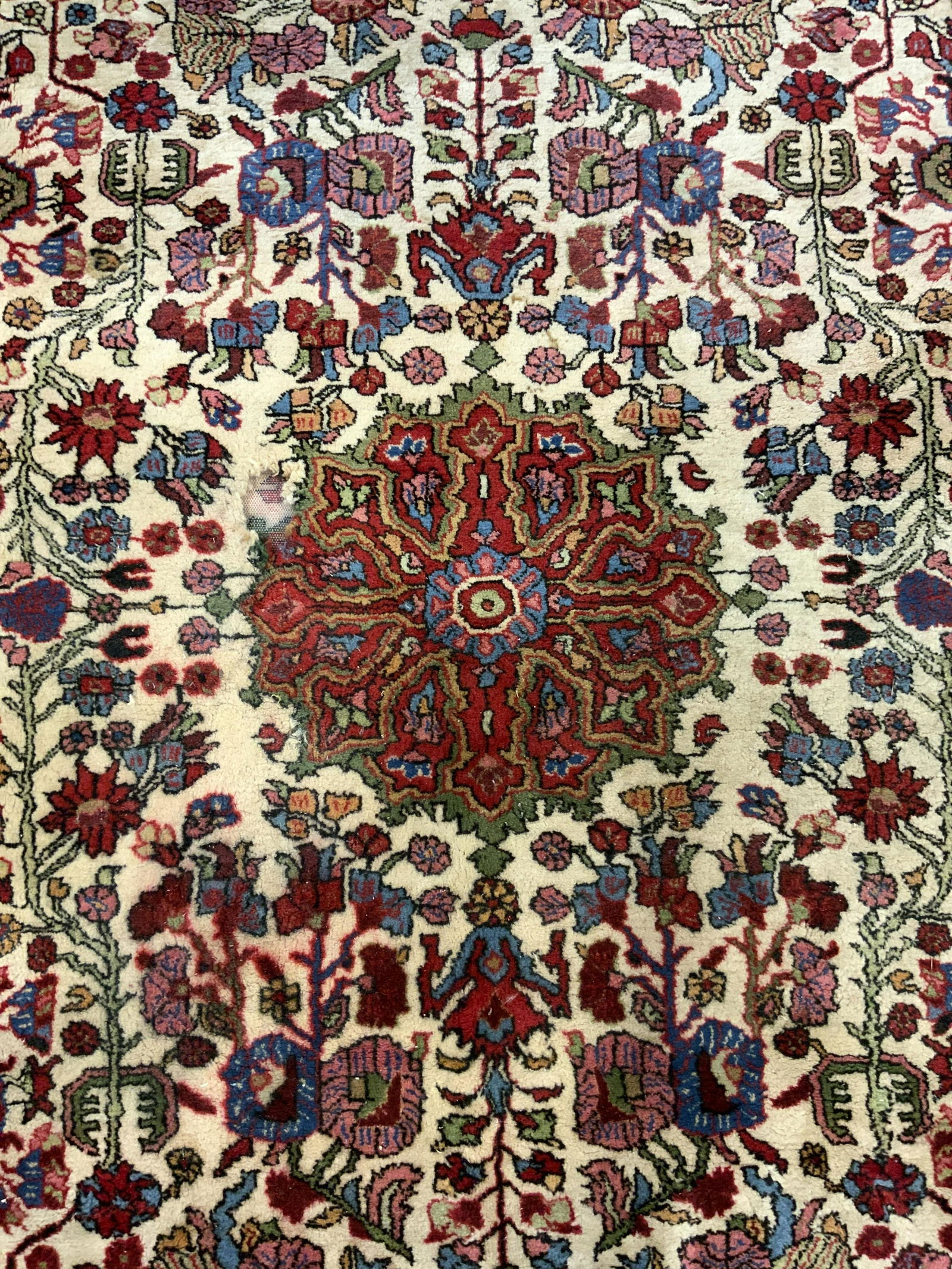 Vintage Handmade Persian Wool Pile Rug: Rug is handmade and wool. Piece is vintage possibly antique. Rug has intricate multi toned floral motif & geometric detail with medallion shape in center. Rug measures approx 112 inches long 79 inches