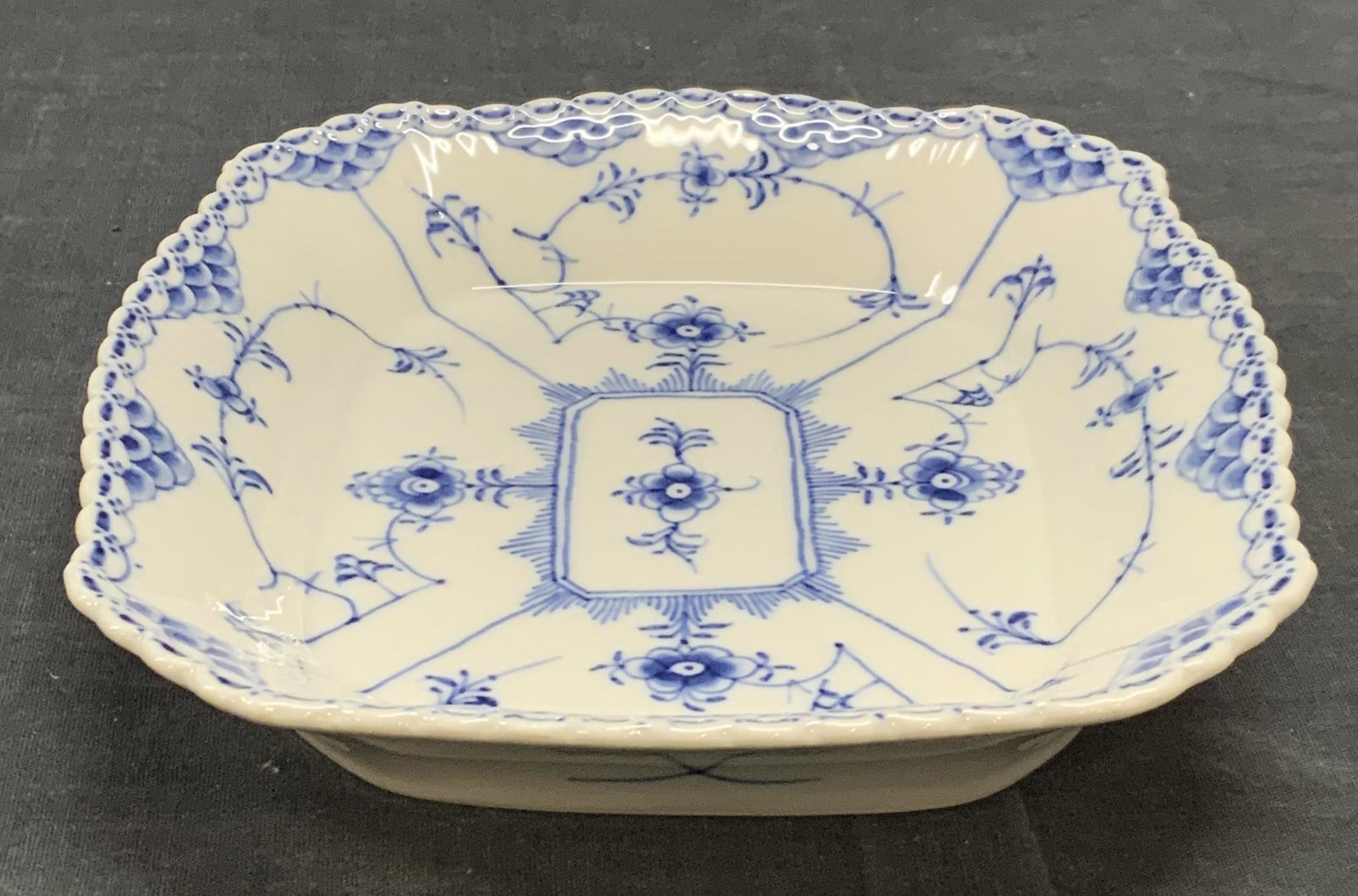Royal Copenhagen Porcelain Floral Dish, Denmark: Royal Copenhagen hand painted porcelain dish with floral motif in blue and white. Blue Lace pattern. Trademarked to underside. Made in Denmark. In good condition. Measures approx. 8 x 6.75 x 1.25 inch