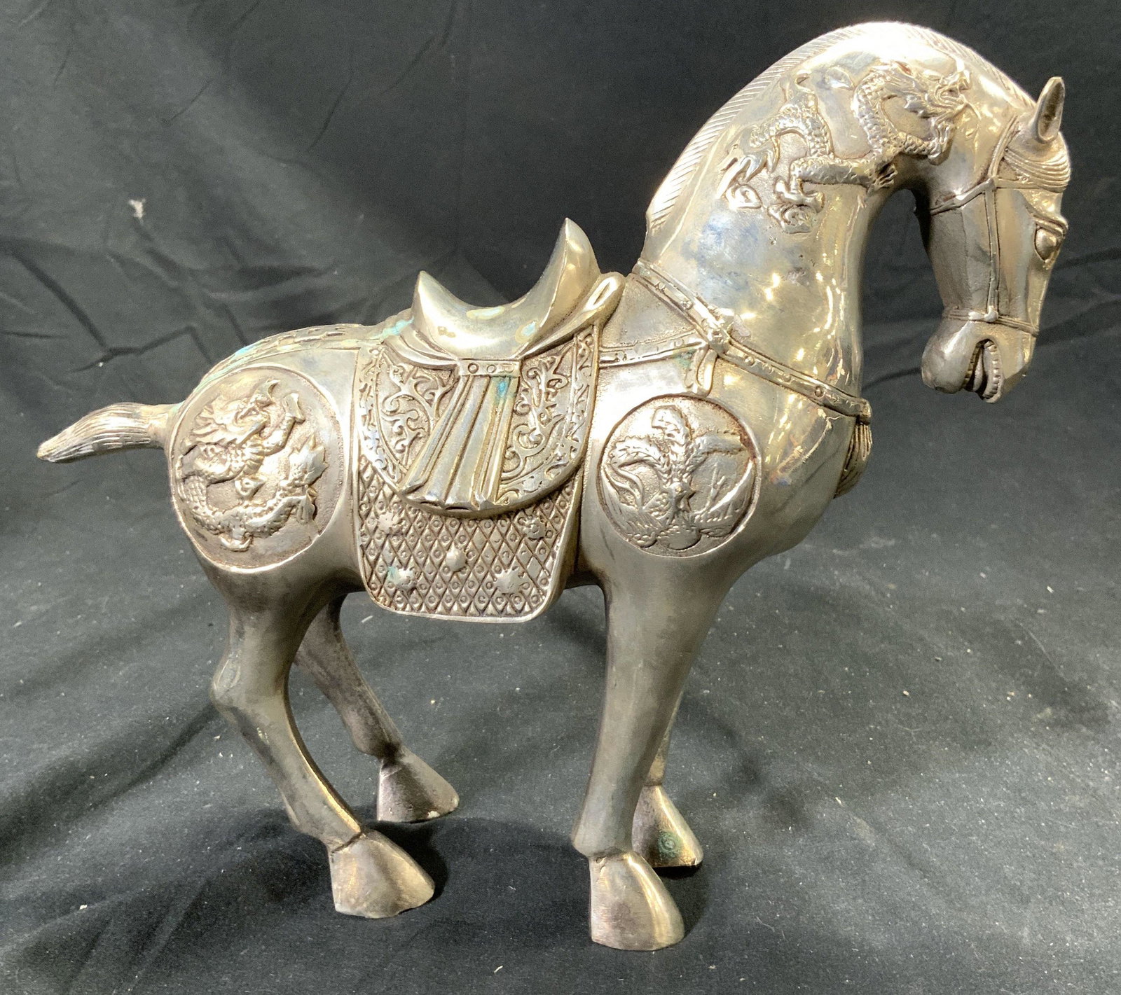 Vntg Asian Silvered Brass Horse Sculpture: Horse sculpture is silvered brass. Piece depicts horse with saddle, dragon & geometric detail. Sculpture measures approx 10 inches deep 8.25 inches tall 3.25 inches wide. Horse sculpture, horse figura