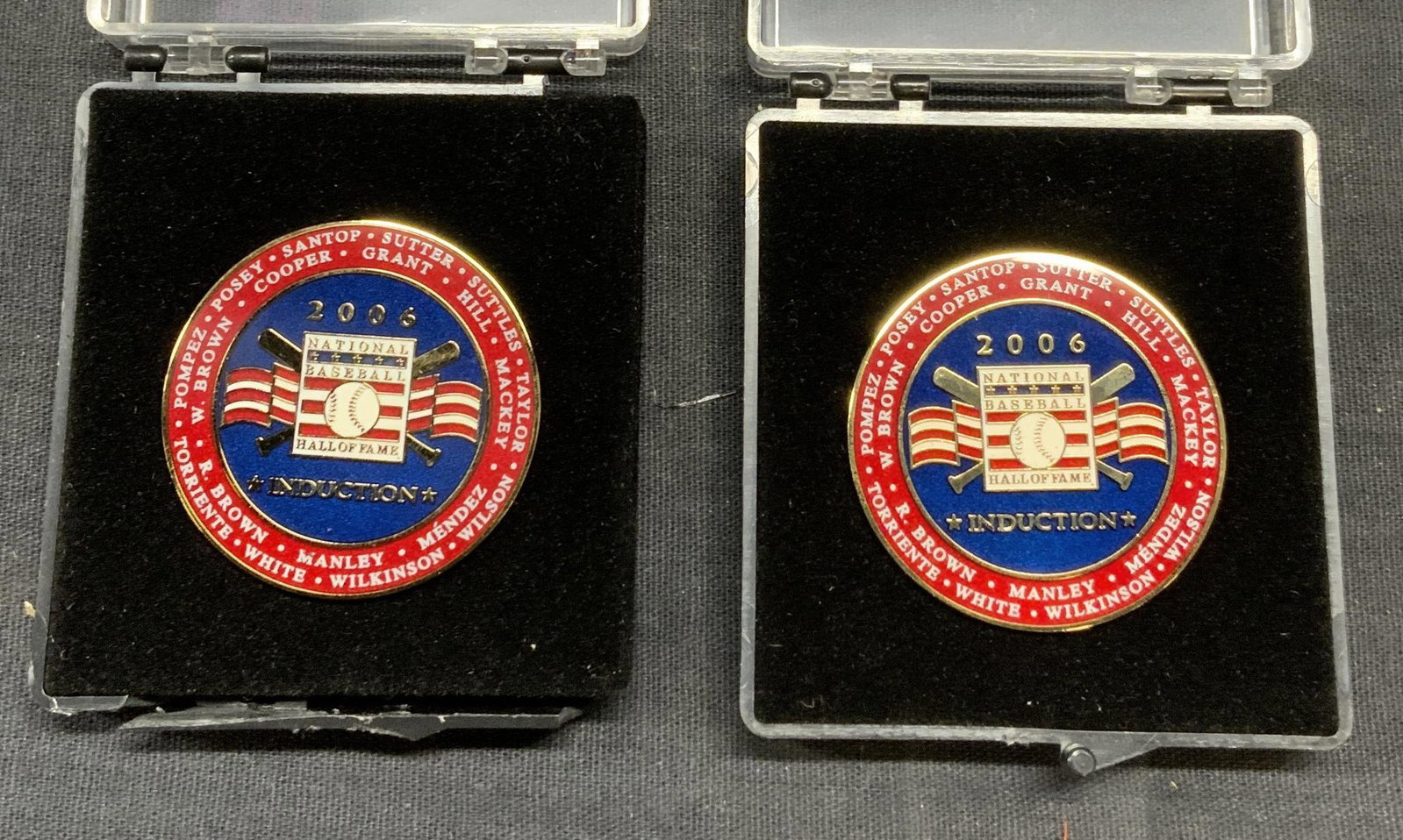 Pair 2006 National Baseball Hall of Fame Pins: Pair of 2006 National Baseball Hall of Fame induction enameled Metal pins in cases. Measure approx. 1 3/8 inches diameter each. Cracking to one case observed. Property of 5th Avenue Manhattan Estate c