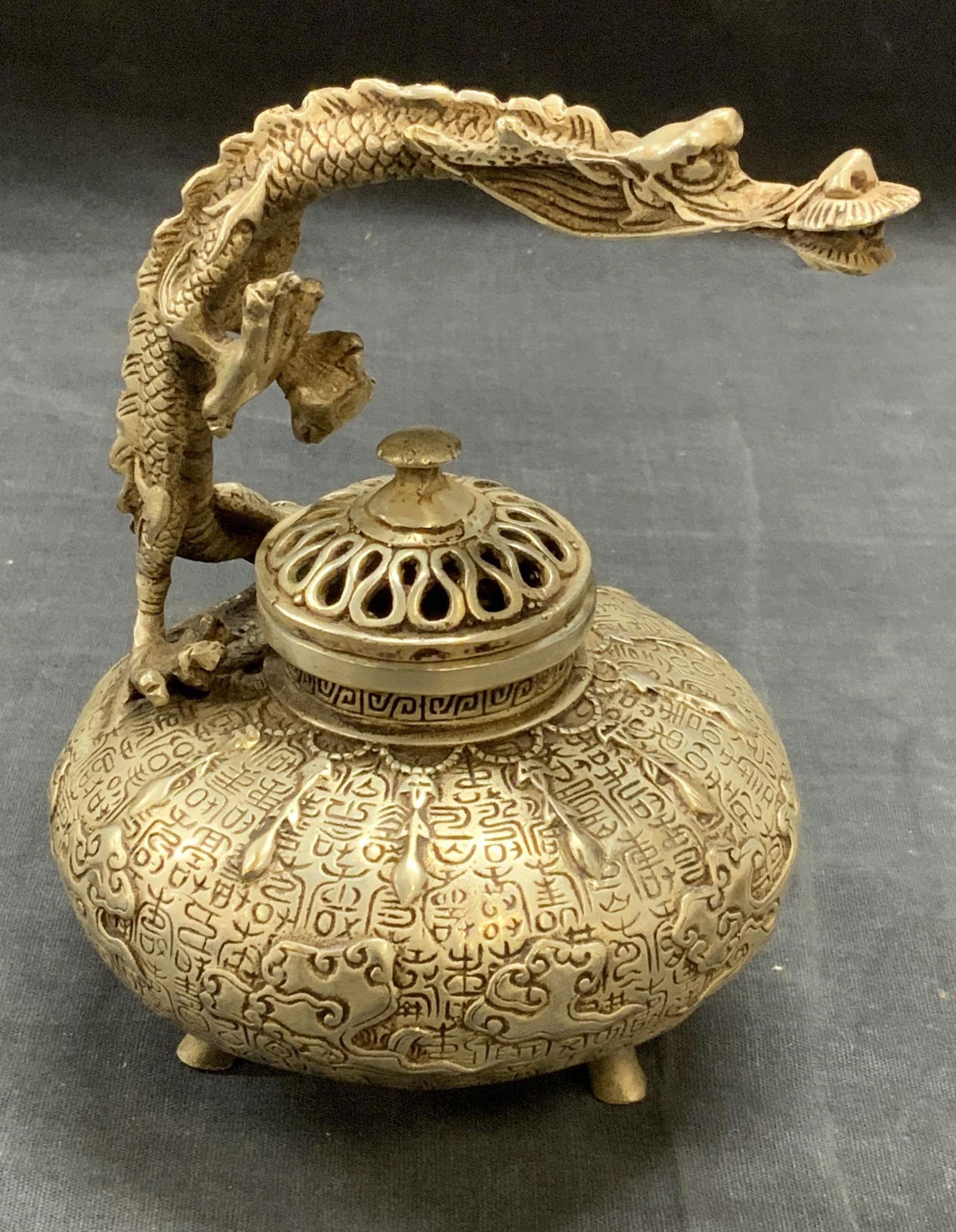 Stamped Chinese Pewter Dragon Incense Burner: Stamped Chinese pewter dragon from incense burner. Stamped to underside. Some surface wear consistent with exposure. Measures approx. 4.75 x 5.5 inches. Chinese incense burner, oriental incense burner