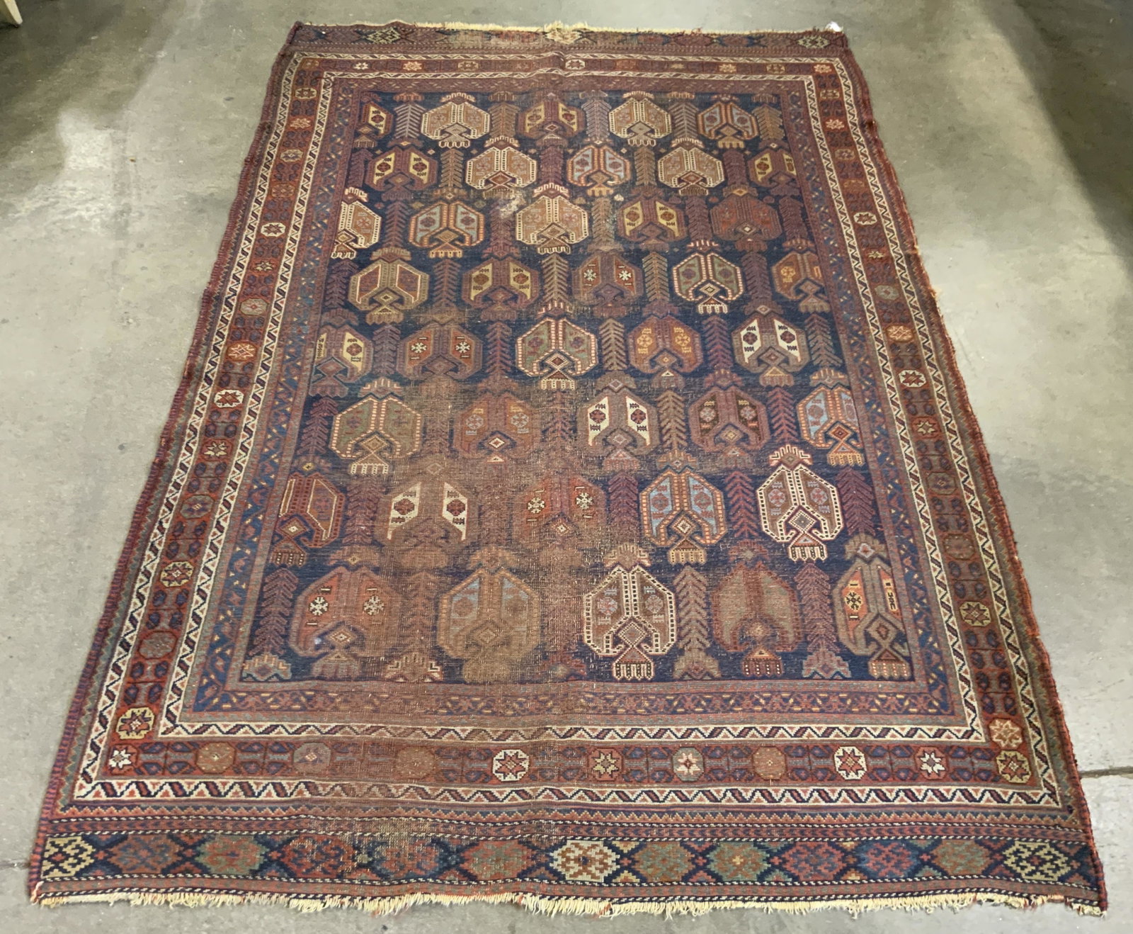 Antique Handmade Persian Wool Area Rug: Rug is handmade and wool. Piece is vintage possibly antique. Rug has intricate multi toned floral motif detail. Piece measures approx 94 inches long 57 inches wide. Rug, carpet, area rug, wool rug, ha