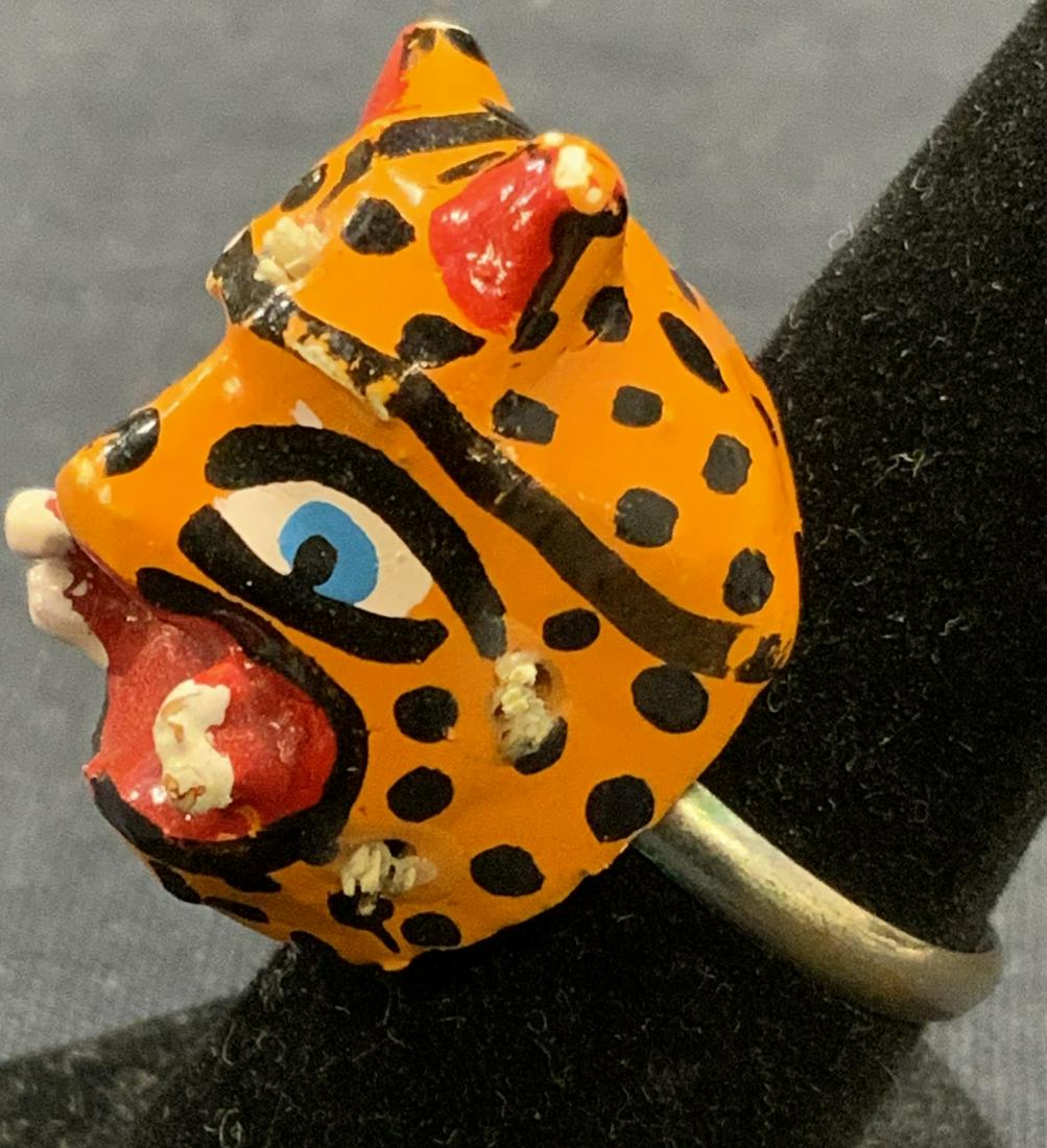 Folk Art Jungle Cat Adjustable Ring: Folk art handcrafted alienated wood jungle cat ring with adjustable band. Fits sizes 4-9. Cat measures approx. 1 x .75 inches. Surface wear consistent with exposure. Estate jewelry, costume jewelry, c
