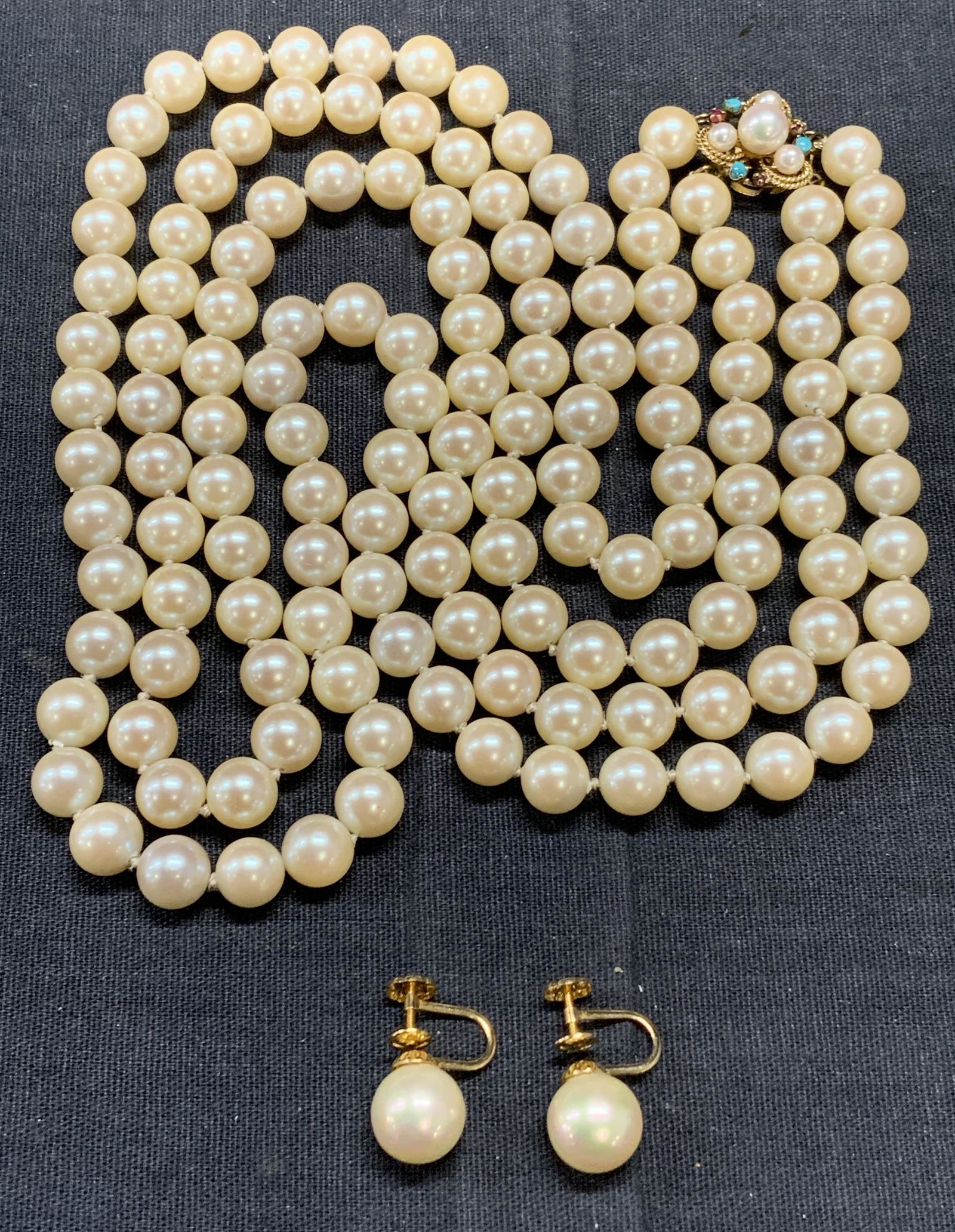 Faux Pearl Necklace & Earrings, 14K Gold Clasps: Faux pearl double strand with 14k gold clasp. Marked 14k to clasp. Measures approx. 23.5 inches long. Faux pearl stud earring with screw backings. Marked 14k to backing. Measure approx. 3/8 inches dia