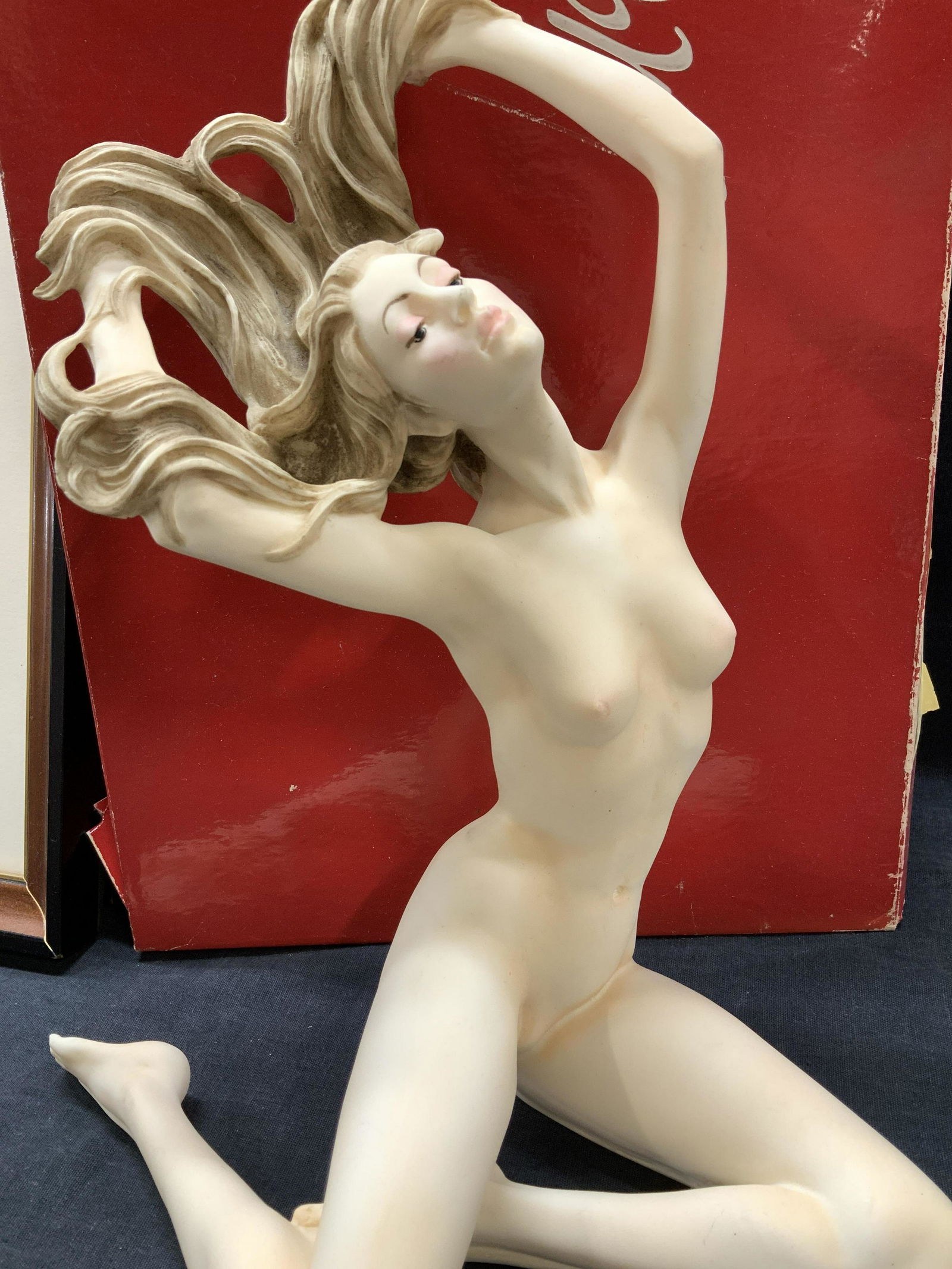 A SANTINI Nude Marble Dust Sculpture, Italy, Sgn: Signed Art Nouveau Nude Woman Figural with hair blowing in the wind and painted face. Made of marble dust, resin, and alabaster. Signature on foot. Sticker label on verso reads Sculptor A Santini Made