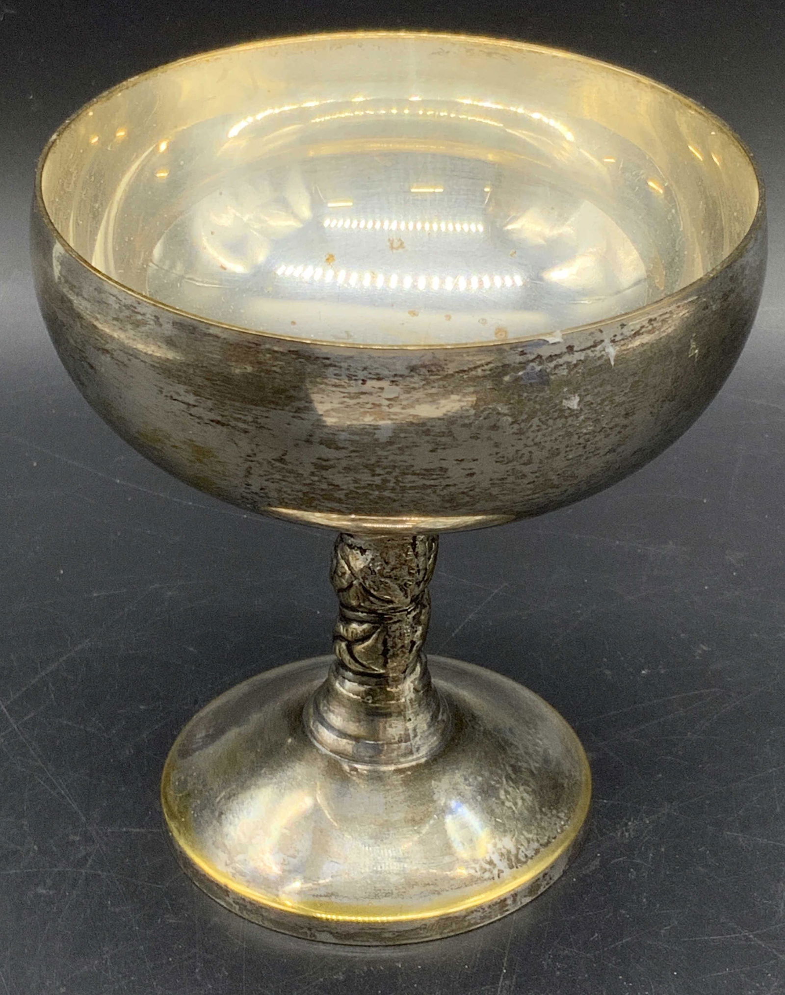 J. PEREZ RUIZ Silver Plated Goblet, Spain: A silver tone metal, possibly silver plated, goblet. Some areas of brass hued metal throughout. Underside marked J. PEREZ RUIZ SPAIN. Measures approx. 4H x 3.5W in. Some wear consistent with age, use,