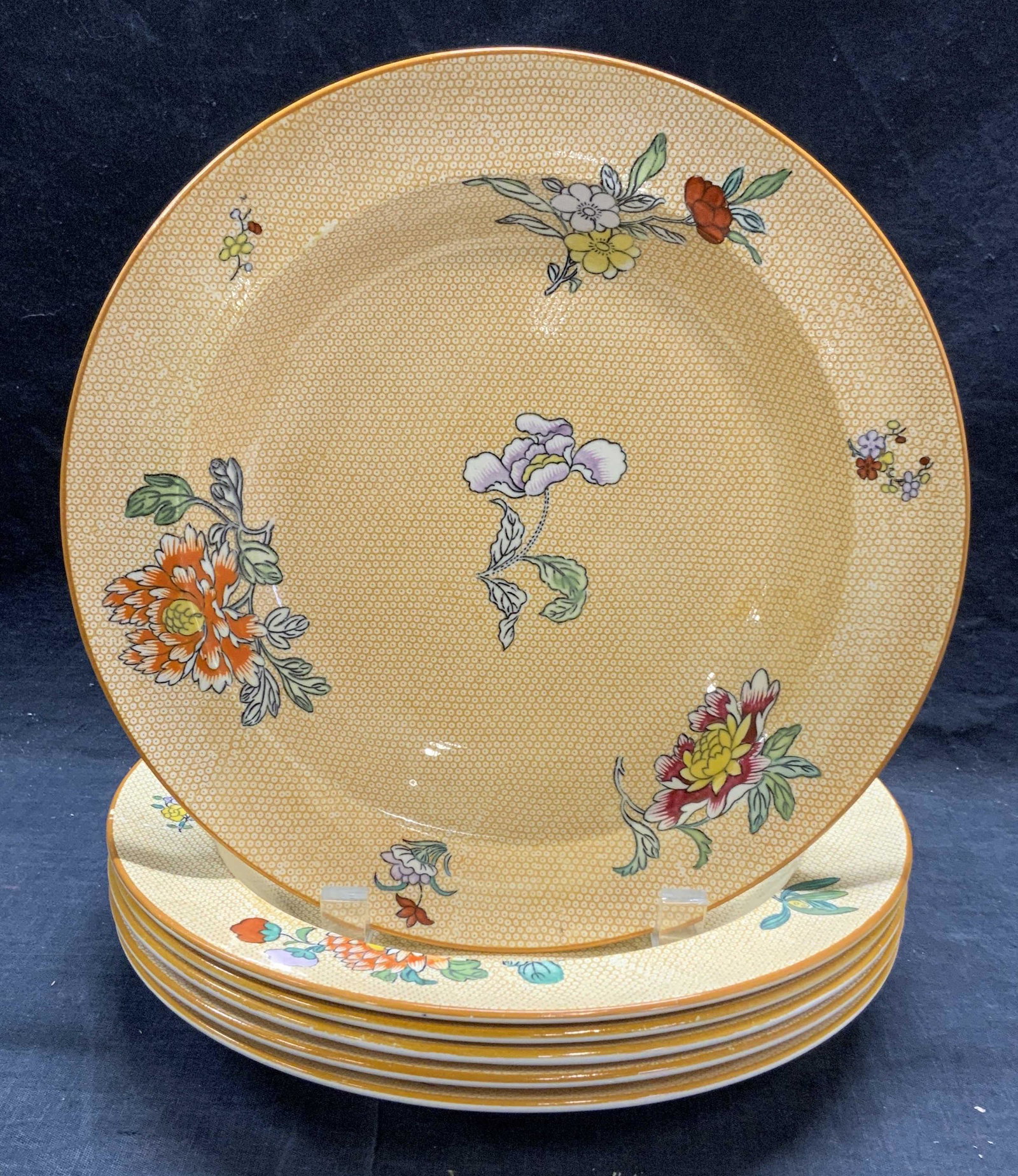 Set 6 WEDGWOOD China Orange Floral Plates: Set of 6 Wedgwood China plates in orange with floral motifs. All pieces trademarked Wedgwood to underside. Some pieces marked Wedgwood of Etruria and William H Plummer Co. all pieces in good condition