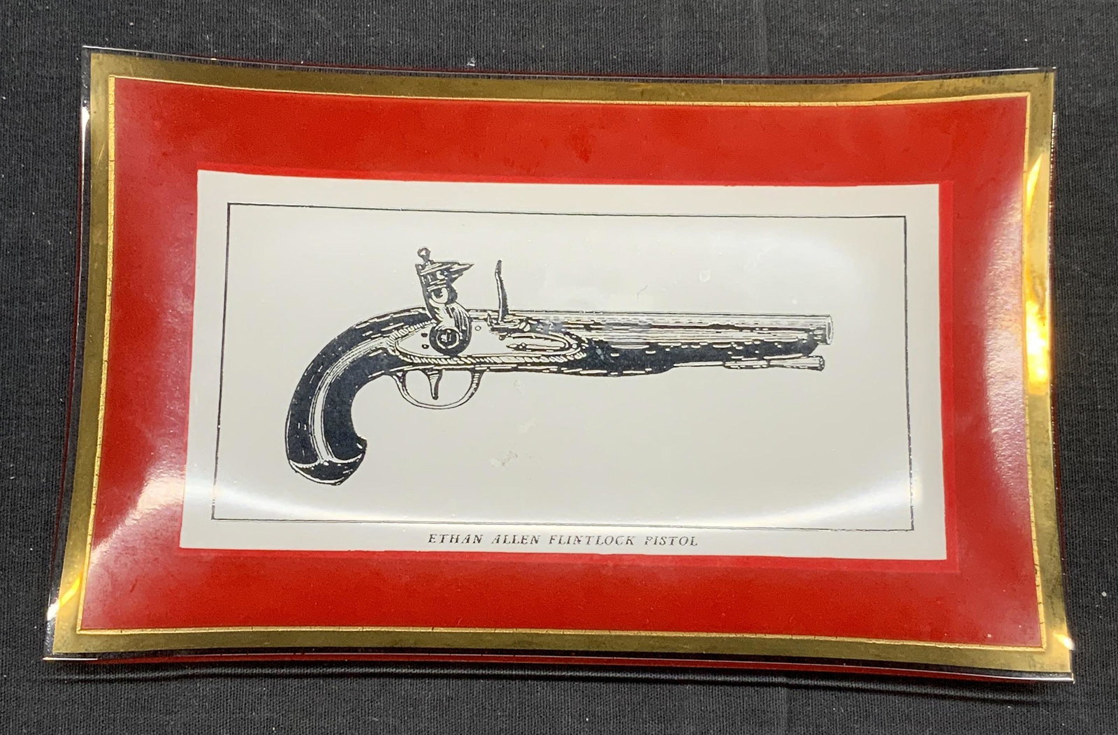 Ethan Allen Flintlock Pistol Trinket Dish: Acrylic trinket/catch all dish with Ethan Allen flintlock pistol motif. Measures approx. 7.75 x 4.75 inches. Ethan Allen, ethan allen flintlock pistol, pistol dish, flintlock pistol dish, trinket dish