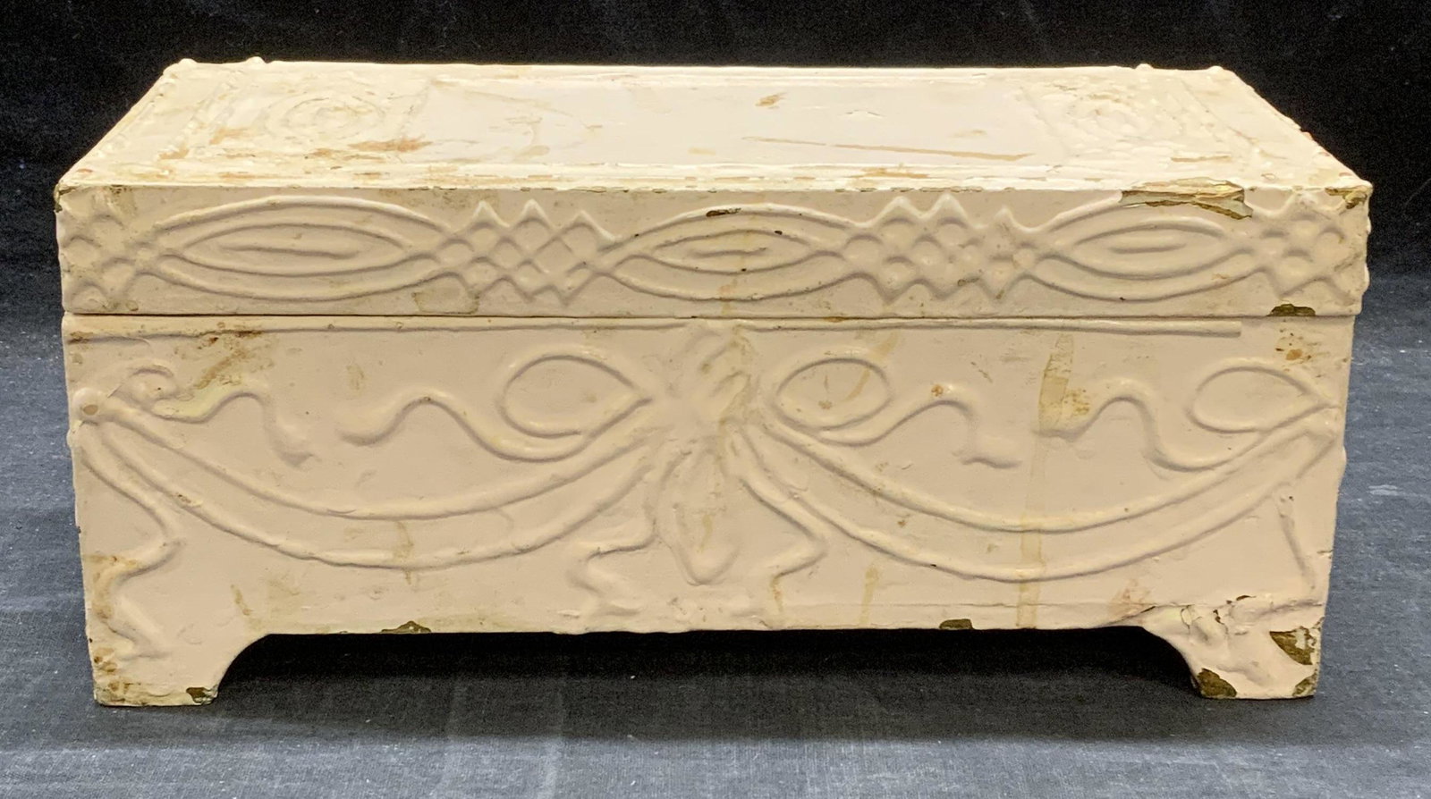 Vintage Pink Wood Dresser Box: Vintage painted pink wooden dressed box with carved ribbon motif. Surface wear consistent with exposure, some loss to paint and blemishes observed. Measures approx. 10 x 4.75 x 4.25 inches. Dresser bo