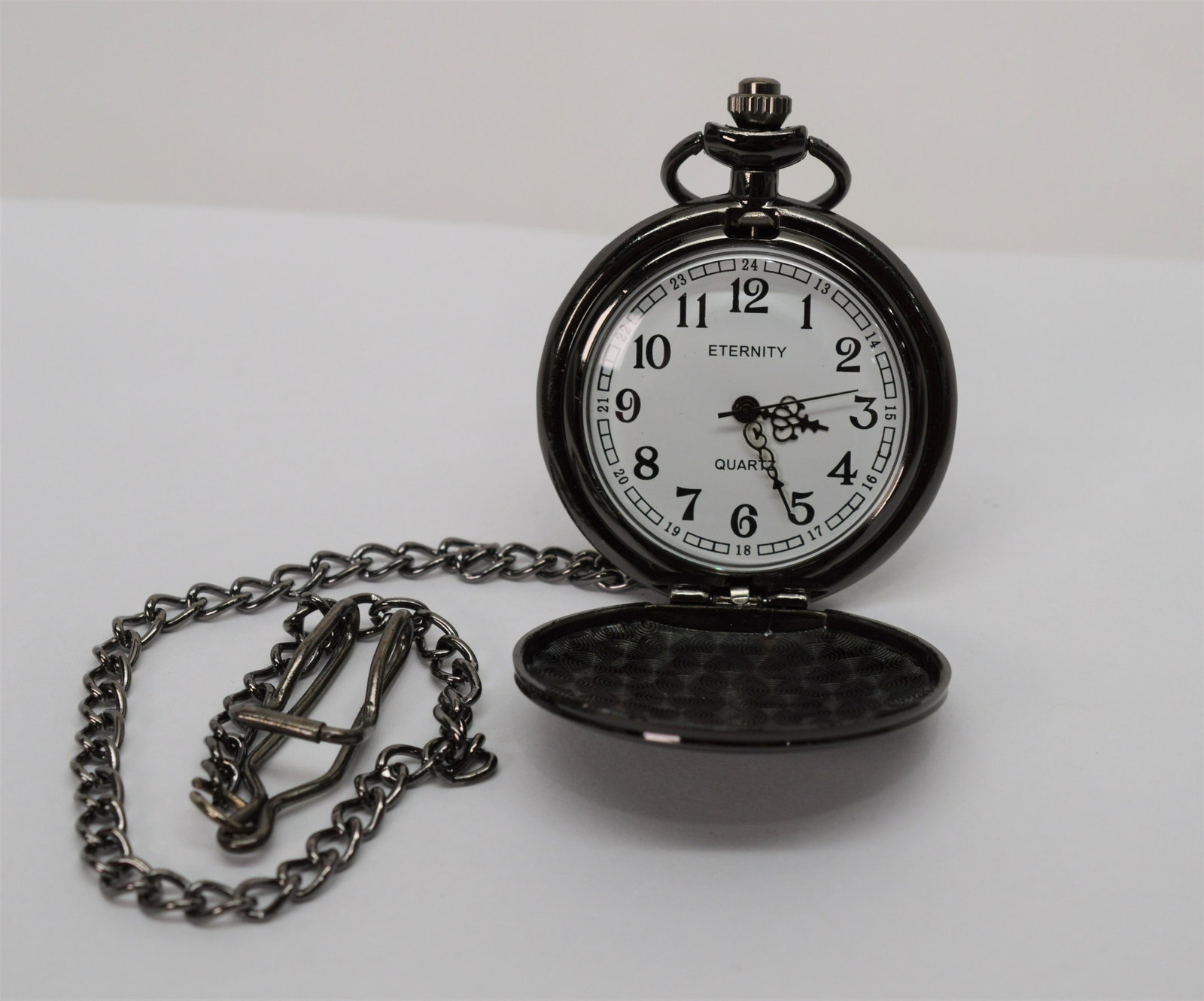 Novelty pocket watches 7 pieces: Brands include Eternity. New, battery operated novelty pocket watches. Protective film on either side of the watch and face should be removed. Watches start by removing the plastic clip to engage batt