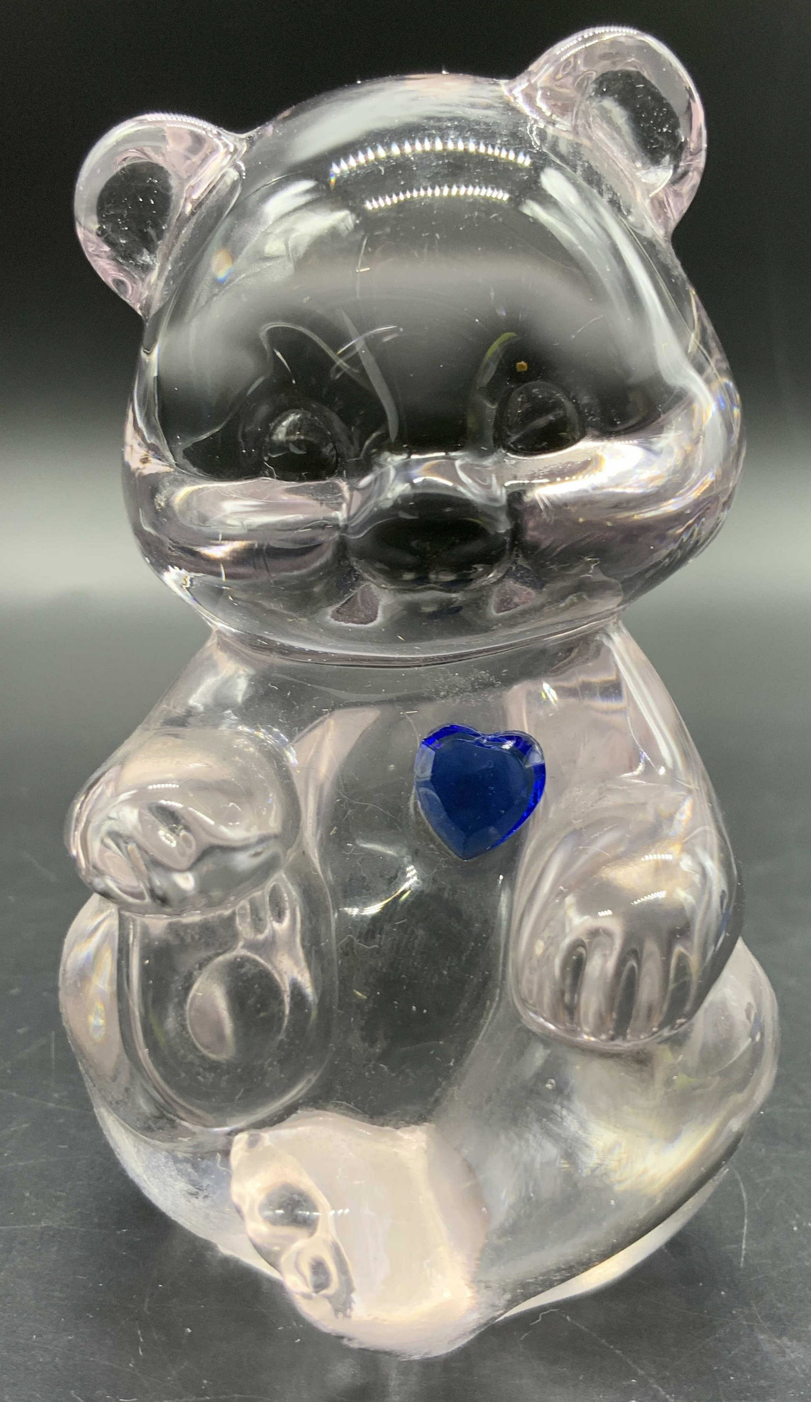 FENTON Vintage Art Glass Bear Figural, Blue Heart: A vintage clear art glass bear with a faceted blue crystal heart to their chest. Measures approx 3H x 2W in. Underside sticker reads FENTON, reverse of bear stamped FENTON. Some surface wear consisten