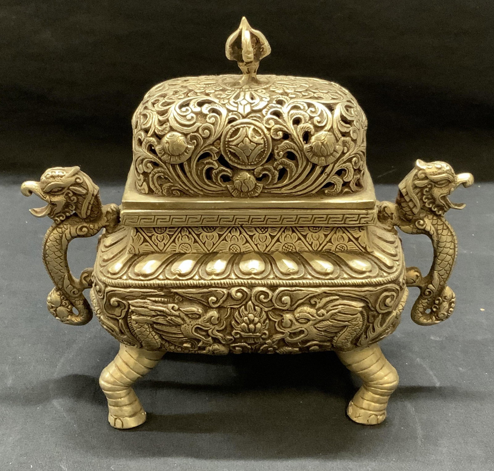 Asian Pewter Dragon Incense Burner: Asian pewter incense burner with dragon motif. Some surface wear consistent with exposure. Measures approx. 6.75 x 3.5 x 6.25 inches. Asian incense burner, oriental incense burner, dragon incense burn