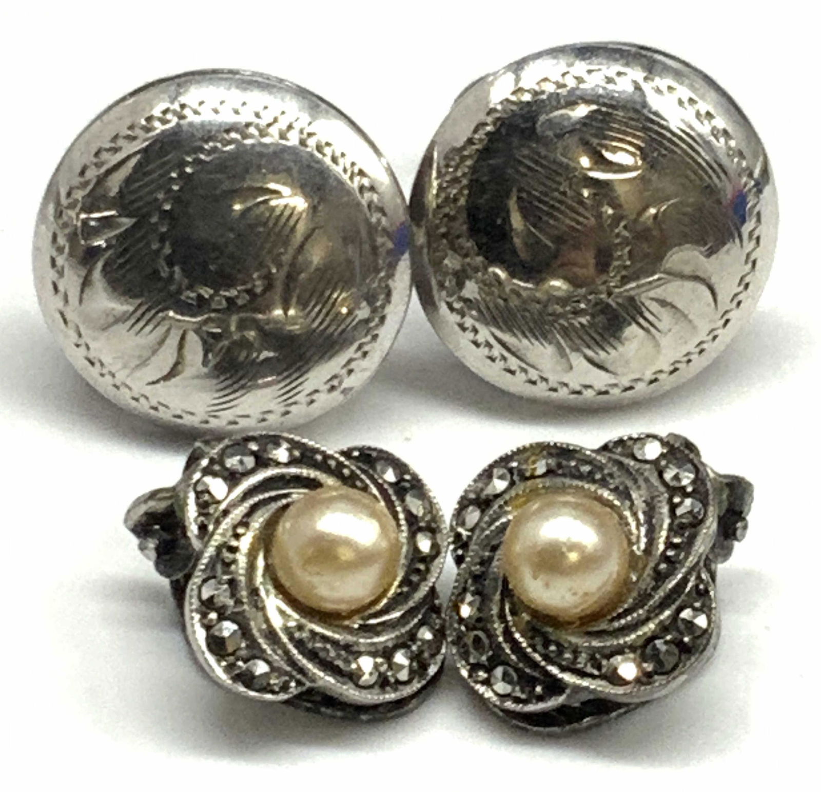 Lt2 STERLING Silver Vtg Earrings, Marcasite & More: Lot 2 vintage sterling silver earrings. Floral form sterling marcasite studded earrings feature a faux pearl bead to the center. Clip on backings. Marked 925. Trademark adjacent to 925. Circular etche