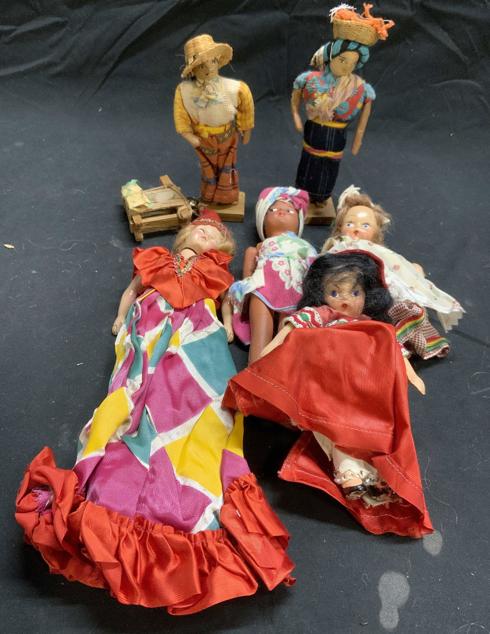 Lot 6 Vintage Hand Painted Dolls: Lot of 6 hand painted doll. Plastic and fabric. Largest measures approx. 7 inches long, smallest approx. 5 inches long. Surface wear to all pieces consistent with exposure. Vintage doll, doll, hand pa