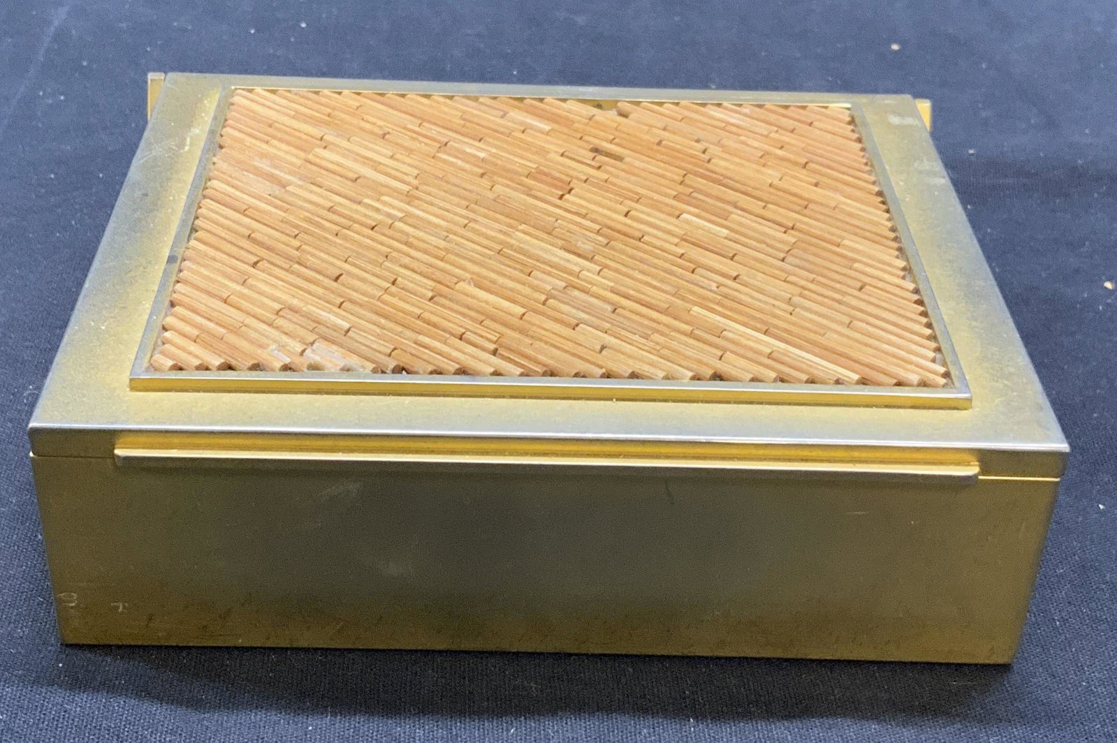 Vintage Gold Tone & Wood Jewelry Box: Vintage gold tone metal jewelry box with wood decoration to lid and felt lined interior. Surface wear consistent with exposure. Measures approx. 5.25 x 4.25 x 1.5 inches. Jewelry box, gold tone jewelr