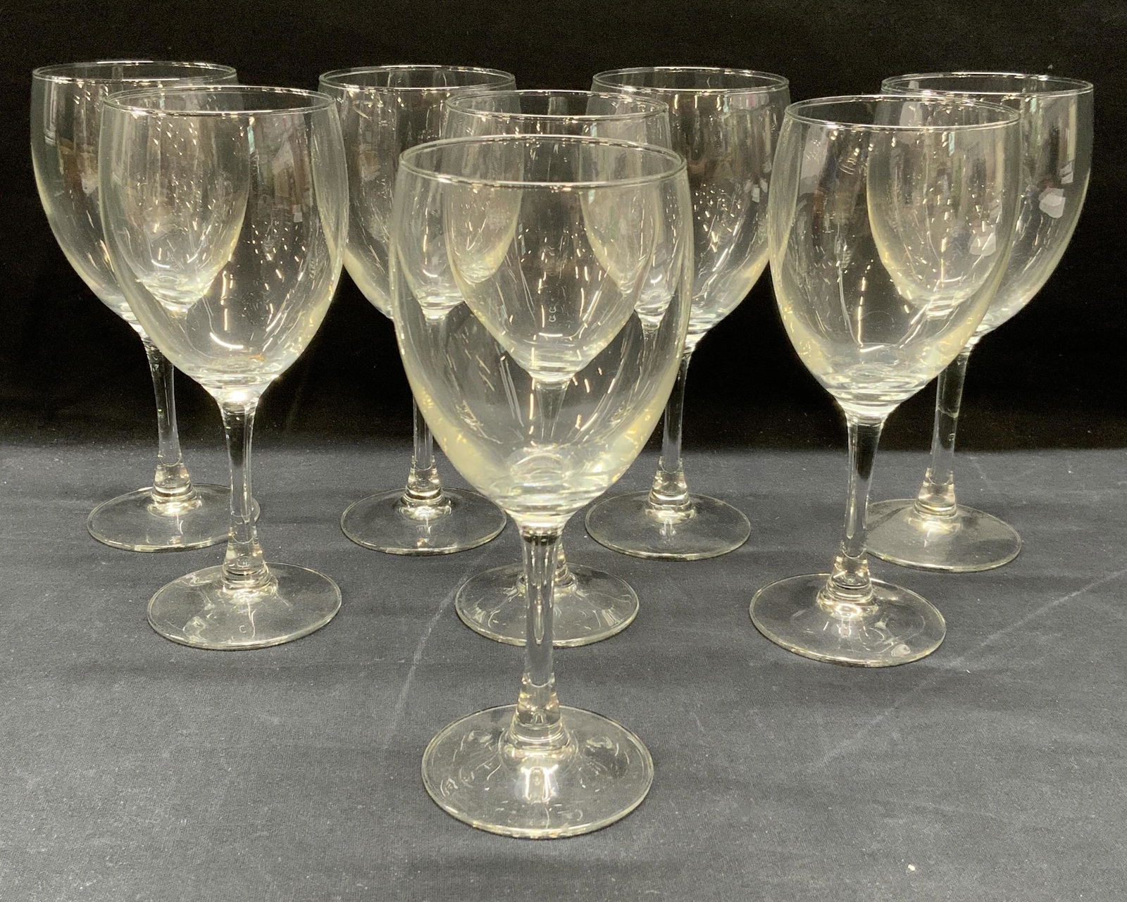 Set 8 Stemware Wine Glasses: Set of 8 stemware wine glasses. Some surface wear to all pieces consistent with exposure. Measure approx. 3 x 7.25 inches each. Wine glass, stemware, Barware, bar accessories, tableware, table accesso