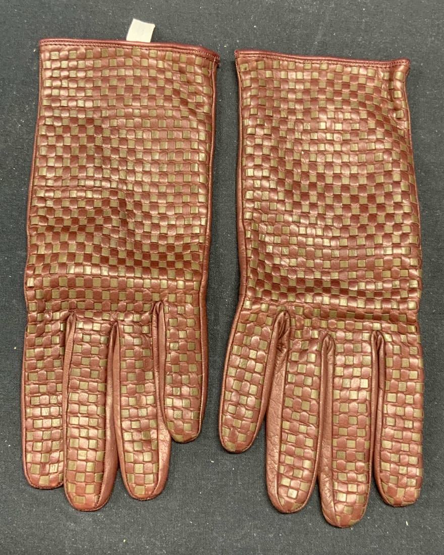 Bergdorf Goodman Burgundy/Brown Leather Gloves: Bergdorf Goodman burgundy and brown leather gloves. Designer label to interior. Size 8. Some wear consistent with exposure. Measure approx. 9 x 3.25 inches. Ladies gloves, ladies leather gloves, ladie