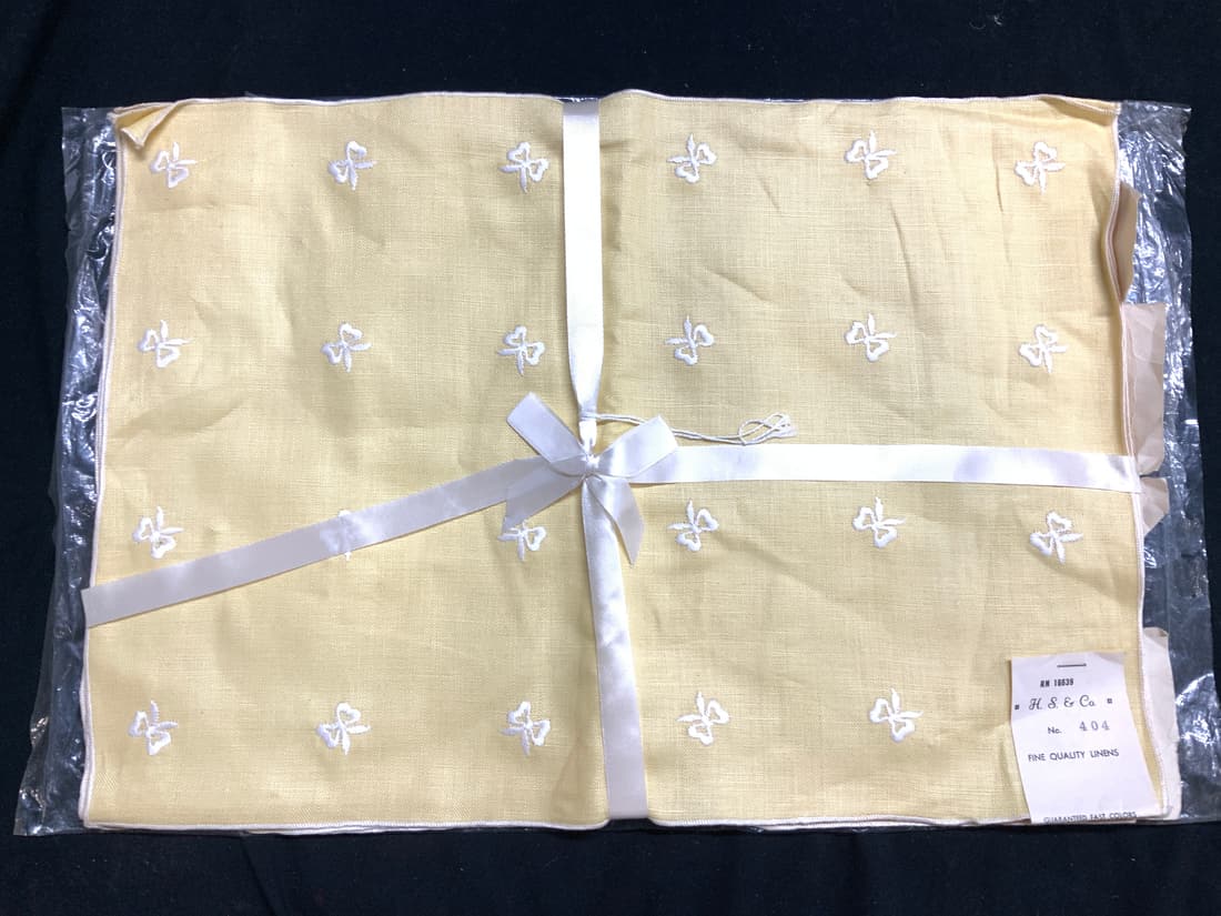 Vtg H.S.& Co Yellow Linen Placemat Set 4, NIP: These are old stock linen placemats , yellow with white embroidered bows. Never used and still in package with org label stapled to item. Fine quality linens by H.S. & Co. each measure 17.25 x 12 in.