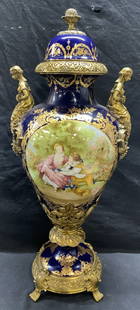 Sevres Style Porcelain & Bronze Urn, 2ft7in XL: Vintage French Sevres style cobalt porcelain and gilt bronze lidded urn. Hand painted Fragonard scene figural motif with gilt decoration. Cast bronze female figural finials and scroll borders.