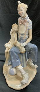 LLADRO At the Circus Clown&Ballerina Statue, Spain: Handmade Lladro Porcelain sculpture titled AT THE CIRCUS, c. 1980-1985. HALLMARKED on verso with impressed # L-90 & signed by artist. Features a circus clown and ballerina sitting on a circus block, c