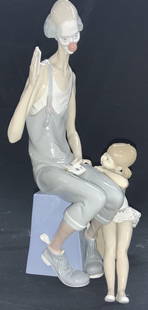 LLADRO Magic Circus Clown & Ballerina , Spain: Handmade Lladro Porcelain sculpture titled MAGIC. HALLMARKED on verso. Features a circus clown showing a ballerina a card trick . The sculpture measures 16.5 inches ht and 9 inches at its widest. High