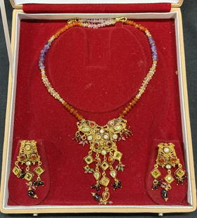 Kothari Jewellers Gemstone Necklace & Earrings: Kothari Jewellers gemstone necklace and earrings set. Includes jewelry box. Quartz, amethyst and carnelian beaded necklace with elephant pendant and crystal decoration. Measures approx. 16 inches long