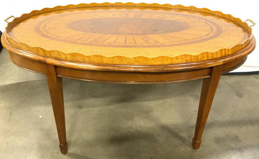 BIEDERMEIER Antqu Mahogany Oval Butlers Tray Table: Has classic pie crust wood gallery with brass end open handles. The tops decorative wood inlays reveals borders of flame, narrow solid mahogany with decorative inlay center. Possibly satin birch wood,