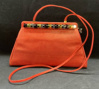 Judith Leiber Coral Snakeskin Handbag NWOT: New without tag Judith Leiber snake embossed coral toned leather handbag with metal hardware decoration. Designer label to interior plaque, 1 slip pocket and 1 zippered pocket to interior. Measures ap