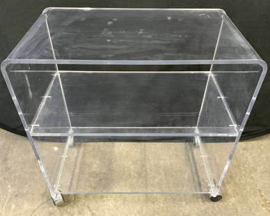 AKKO MCM Acrylic Bar Cart Tea Cart: Tag on base reads AKKO CLASSIC ELEGANCE IN ACRYLIC. Piece has waterfall edges to table top. Piece has mid tier shelf & lower tier. Cart measures approx 28 inches tall 27 inches long 15 inches deep. Te