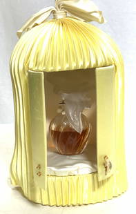 N Ricci LALIQUE l'Air Du Temp Perfume: Nina Ricci l'Air Du Temps luxury crystal perfume bottle with famous Lalique frosted Doves Stopper. Comes in this RARE yellow satin ‘birdcage display box. ( 8 x 5 in.) Perfume Bottle is marked Nina R