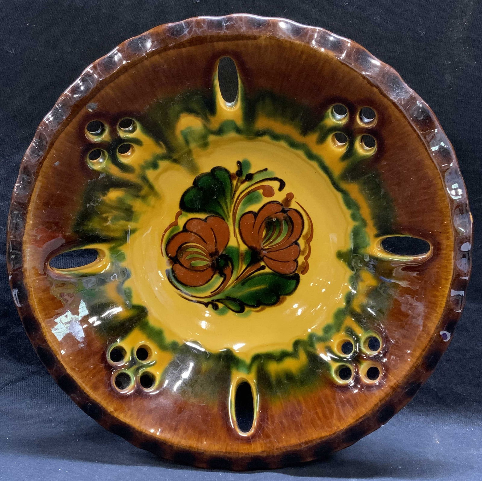 Vintage Signed Art Pottery Bowl: Vintage signed art pottery bowl with floral motif. Signed to underside, illegible. Some surface wear consistent with exposure. Measures approx. 10 3/8 x 2.25 inches. Art pottery, art pottery bowl, dec