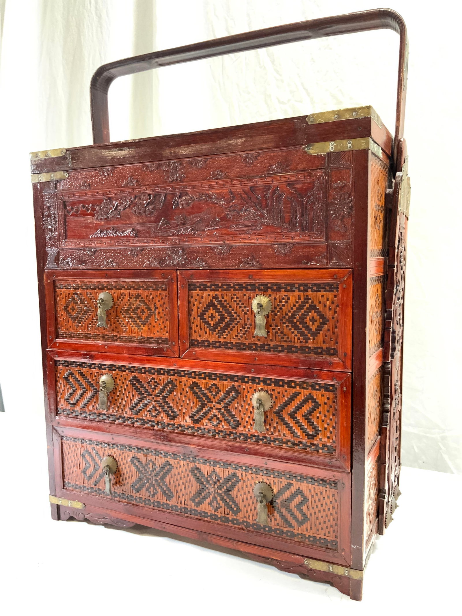 Rosewood Woven Asian Wedding Chest: Wedding chest is vintage possibly antique. Piece has 4 drawers. Appears to be rosewood with caned weaving. Top of piece is lidded. Contains intricately carved landscape detail. Chest has handle. Measu