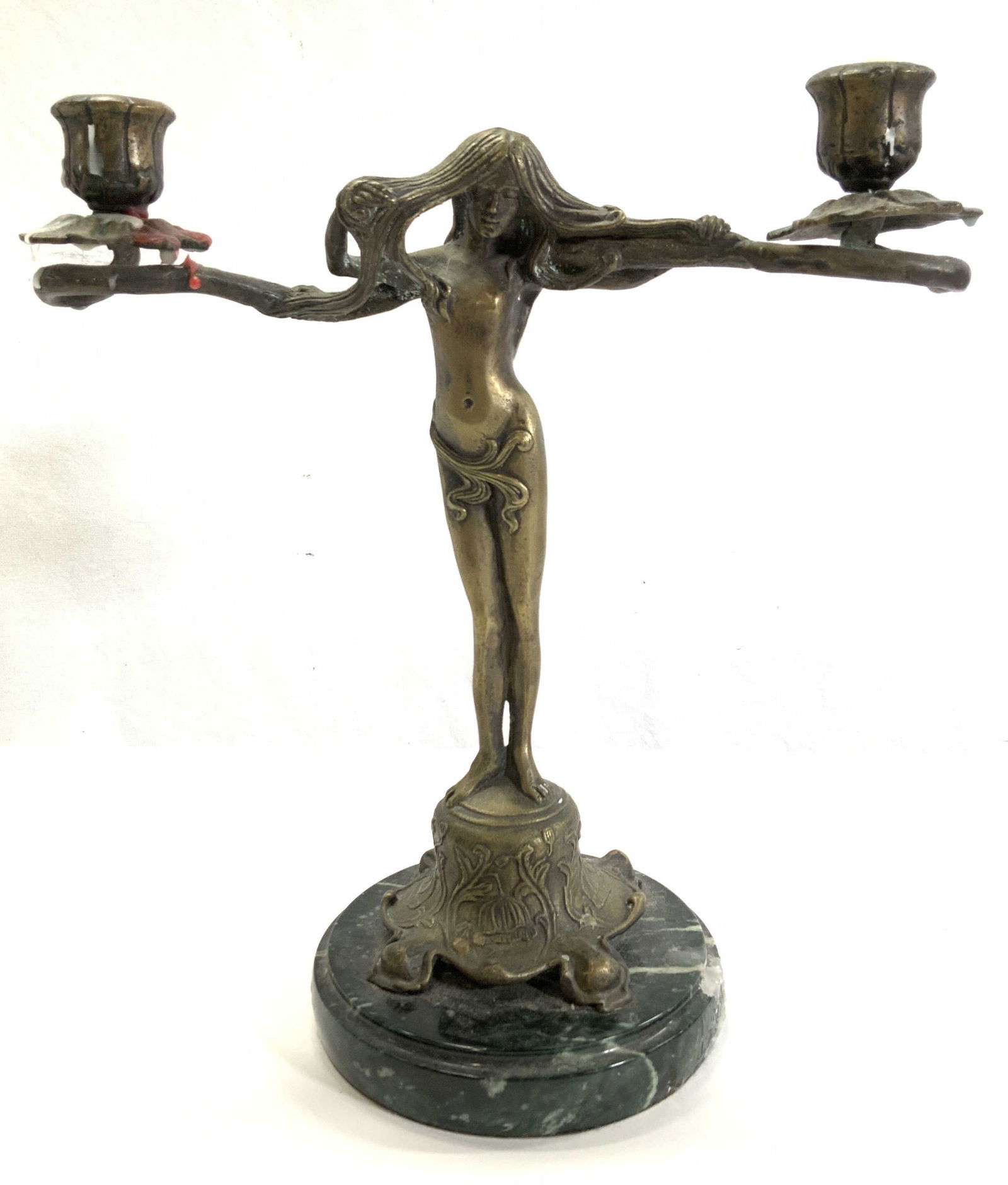Art Nouveau Gilt Bronze Fairy Candlestick: Gilt bronze nude fairy statue in manner of art nouveau style. Dual candle holders rest on her her shoulders. Sculpture is mounted to a green marble base. Possibly antique, early 1900s. 12 in. Height,