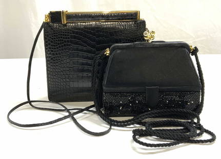 Lot 2 Judith Leiber Black Handbags: Lot of 2 black Judith Leiber handbags. Satin and crystal decorated handbag with 2 compartments. Designer label to metal plaque. Measures approx. 6 x 2.25 x 4.5 inches. Reptile leather handbag. Designe