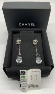 CHANEL Crystal Drop Earrings w Org Box: Chanel silver tone crystal drop earrings with interlocking C studs. Post backings. Including original tag and box. Very gently worn. Measure approx. 2.25 x .5 inches. Signed to backings. Marked Chanel