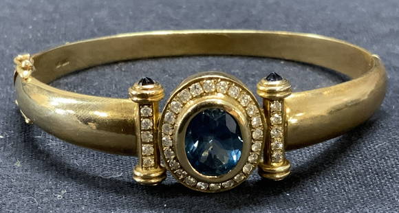 14k Gold, Diamond & Spinel Bracelet: 14k gold bracelet with blue spinel center stone and accents and diamond halo. Marked 14k, 585 to interior band. Some surface wear consistent with exposure. Measures approx. 2 1/8 inches wide, band app