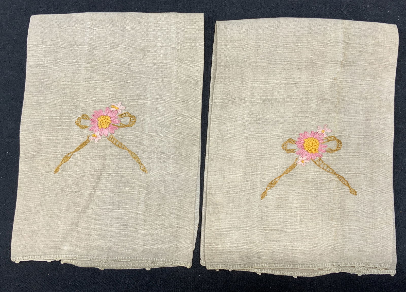 Pair Beige Floral Embroidered Tea Towels: Pair of beige linen floral embroidered tea towels. Some wear to material consistent with exposure. Measure approx. 19 x 17.25 inches. Tea towel, linen tea towel, floral tea towel, beige tea towel, emb